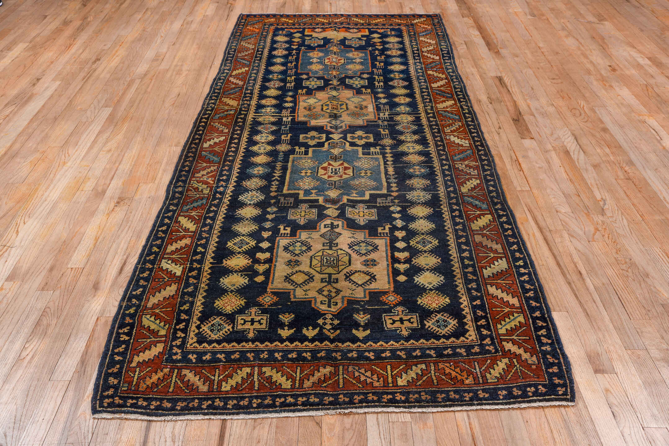 4' x 10' one-of-a-kind handmade vintage Hamadan runner rug. Color palette: black, blue, brown, gray, saddle brown