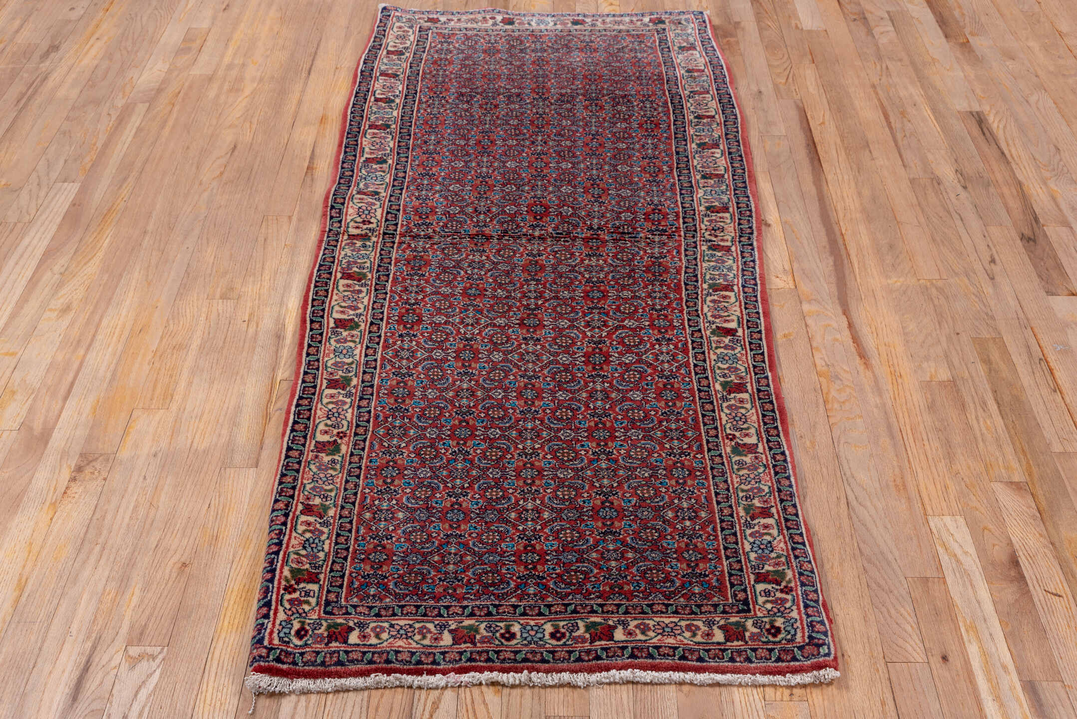 2' x 6' one-of-a-kind handmade vintage Bidjar runner rug. Color palette: brown, gray, pink, red