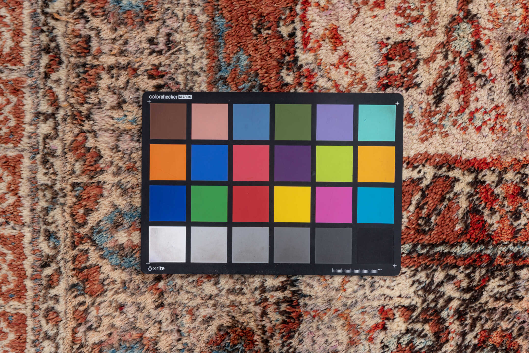 4' x 5' one-of-a-kind handmade vintage Tulu small size rug. Color palette: brown, gray, light gray, off-white, pink, red