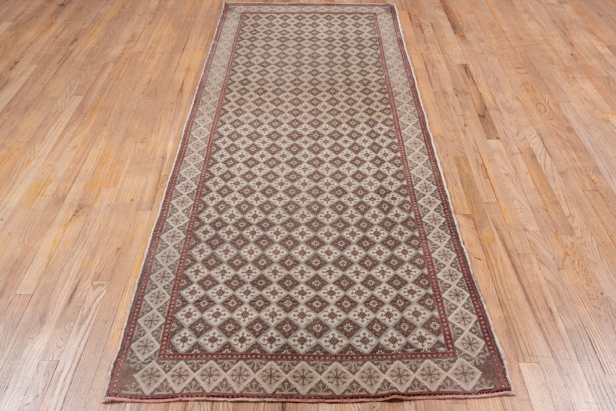 3' x 9' one-of-a-kind handmade vintage Oushak runner rug. Color palette: brown, gray, light gray, off-white, pink