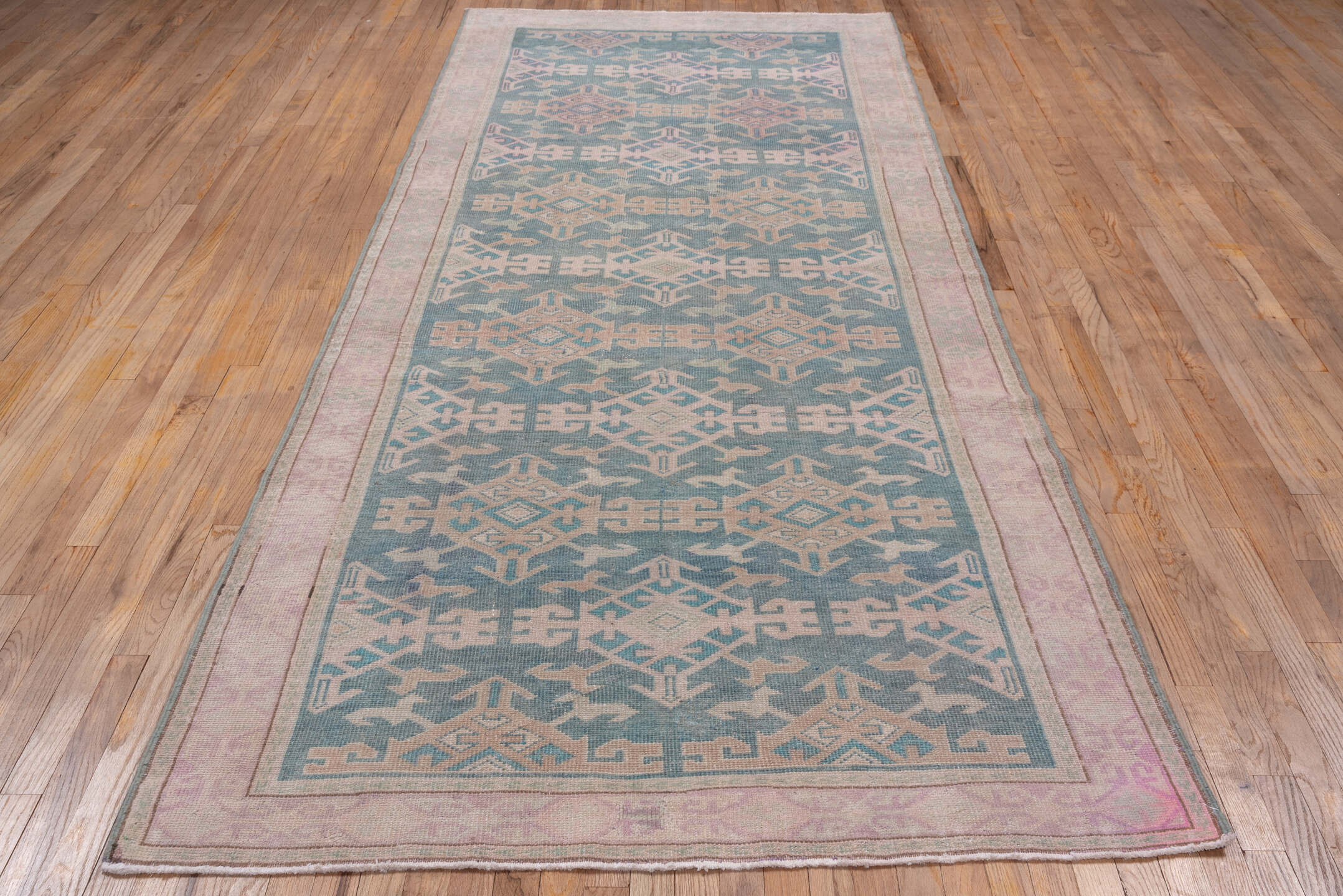 4' x 11' one-of-a-kind handmade vintage Oushak runner rug. Color palette: blue, blush, ivory, taupe, sage, pink, beige, gray