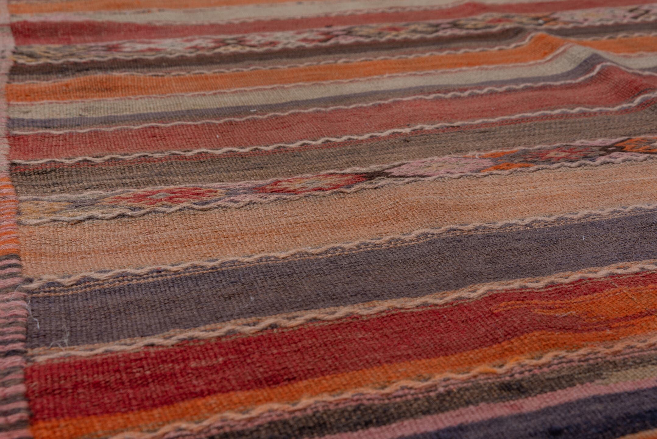 4' x 10' one-of-a-kind handmade vintage Jijim runner rug. Color palette: rust, rose, taupe, brown, charcoal, terracotta