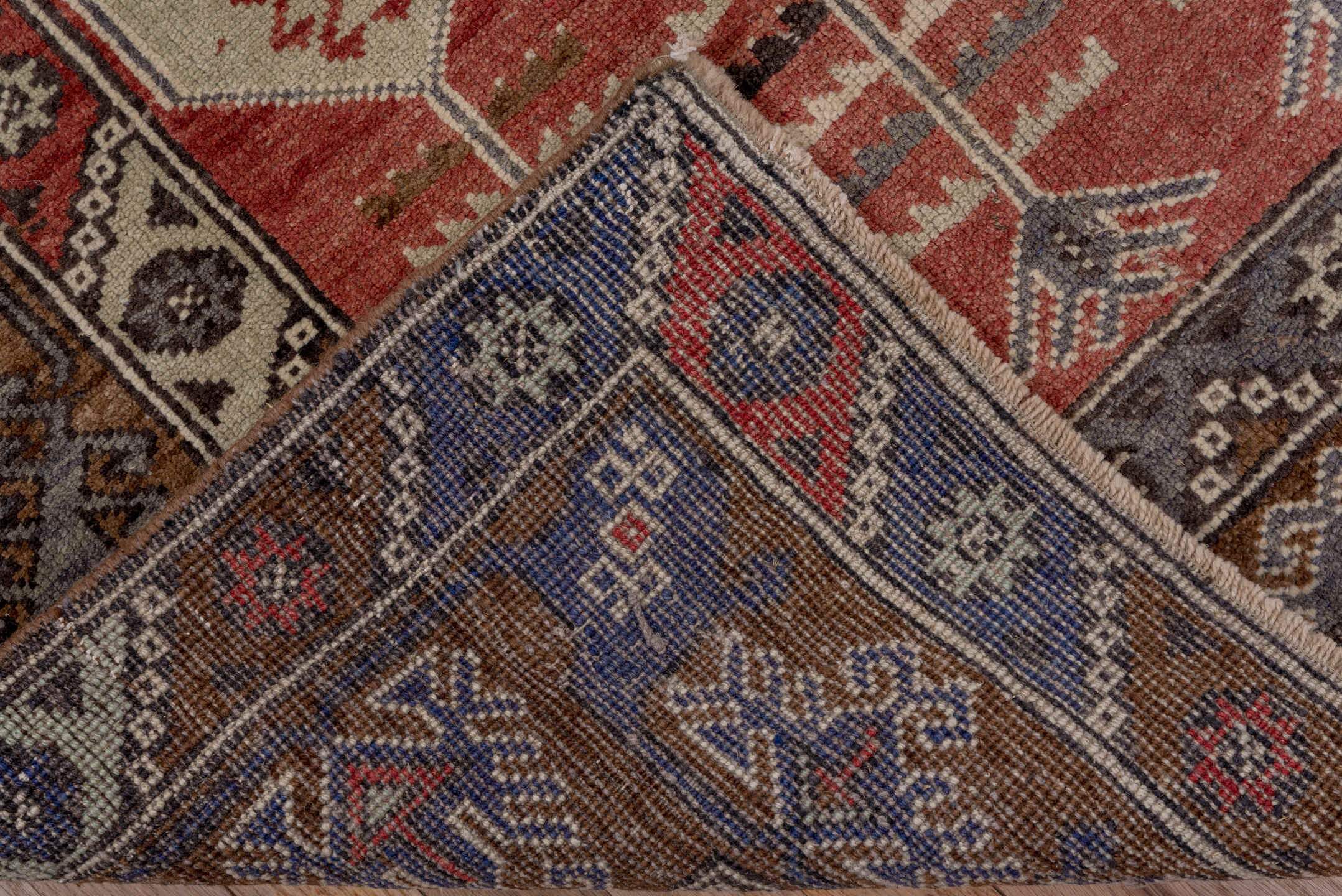 4' x 8' one-of-a-kind handmade antique Konya runner rug. Color palette: brown, coral, ivory, indigo, rust, taupe, slate