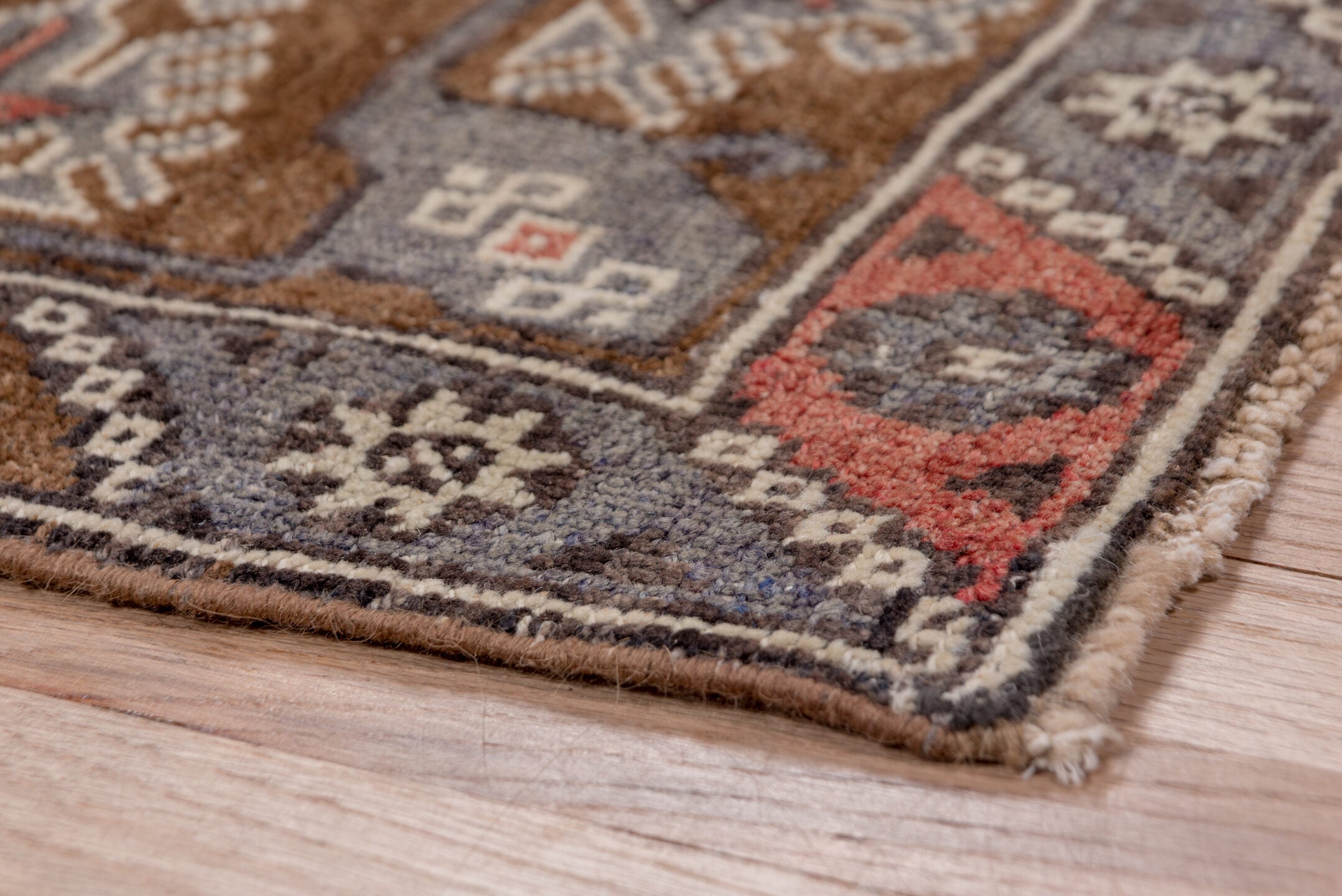 4' x 8' one-of-a-kind handmade vintage Konya runner rug. Color palette: brown, gray, pink, red