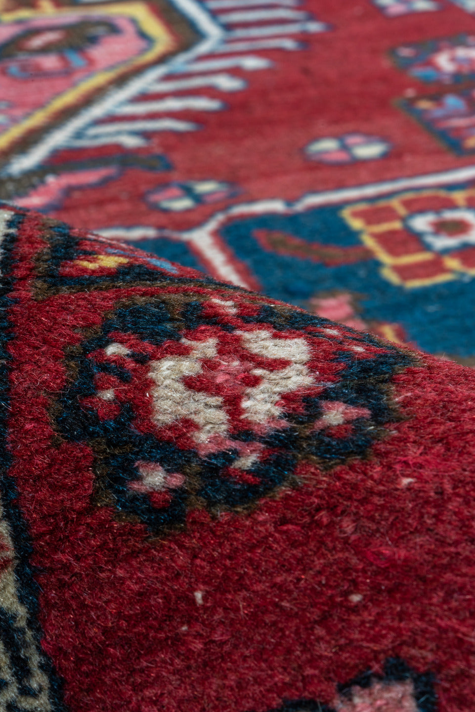 2' x 3' one-of-a-kind handmade vintage Heriz small size rug. Color palette: black, blue, brown, gray, pink, red