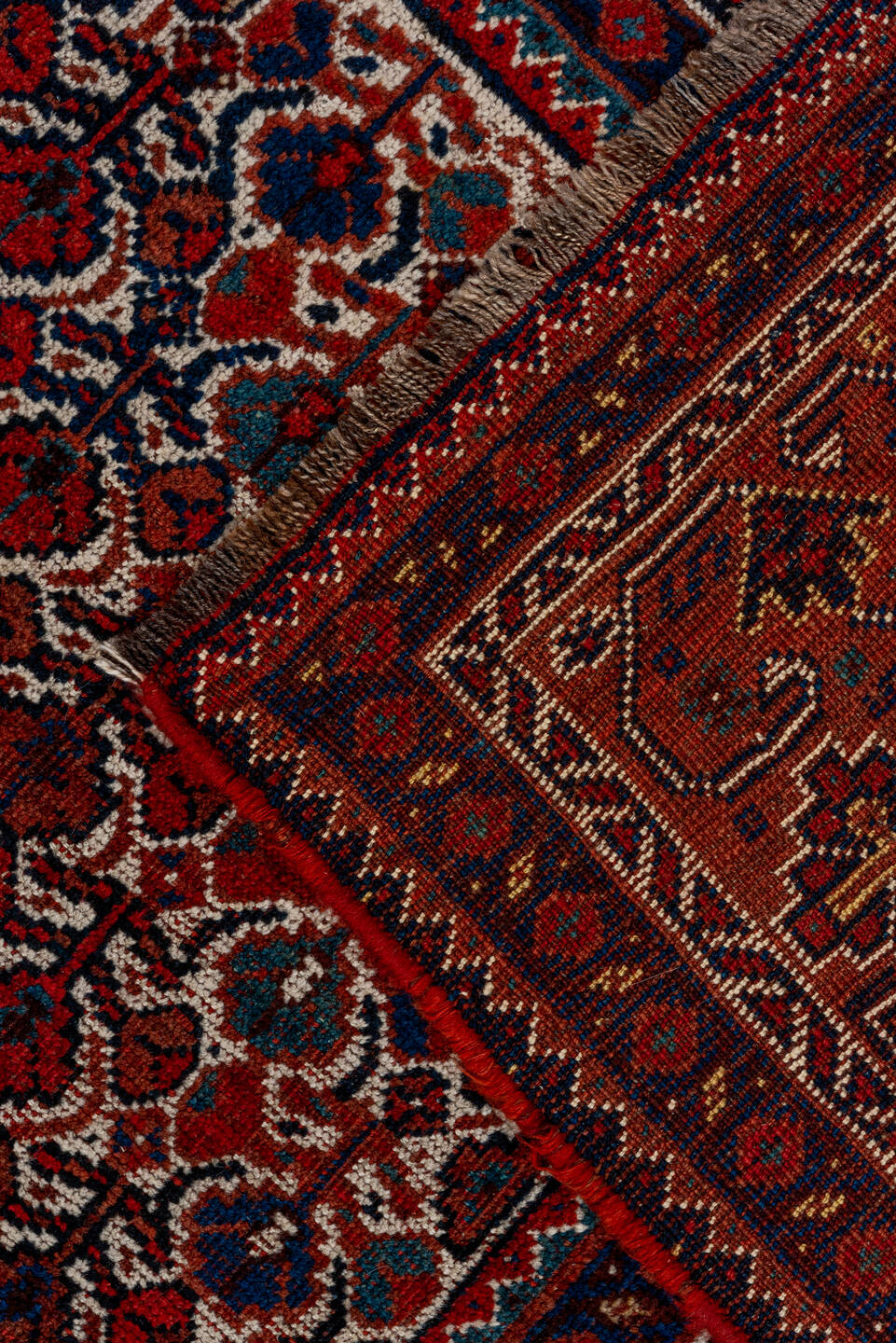 7' x 9' one-of-a-kind handmade antique Shiraz rug. Color palette: rust, navy, ivory, burgundy, terracotta, indigo, camel