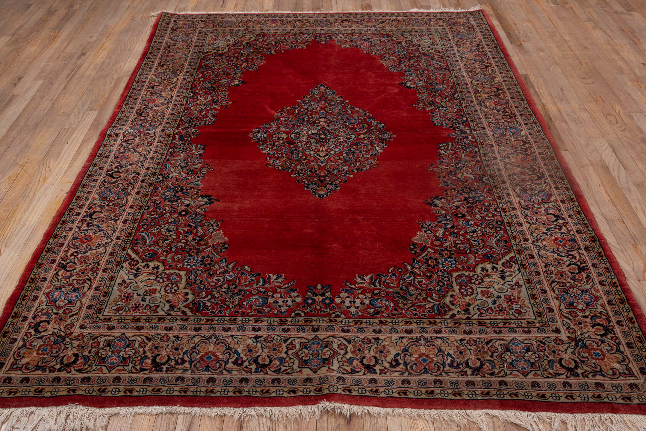6' x 9' one-of-a-kind handmade antique Sarouk medium size rug. Color palette: red, ivory, navy, rose, slate, rust, camel