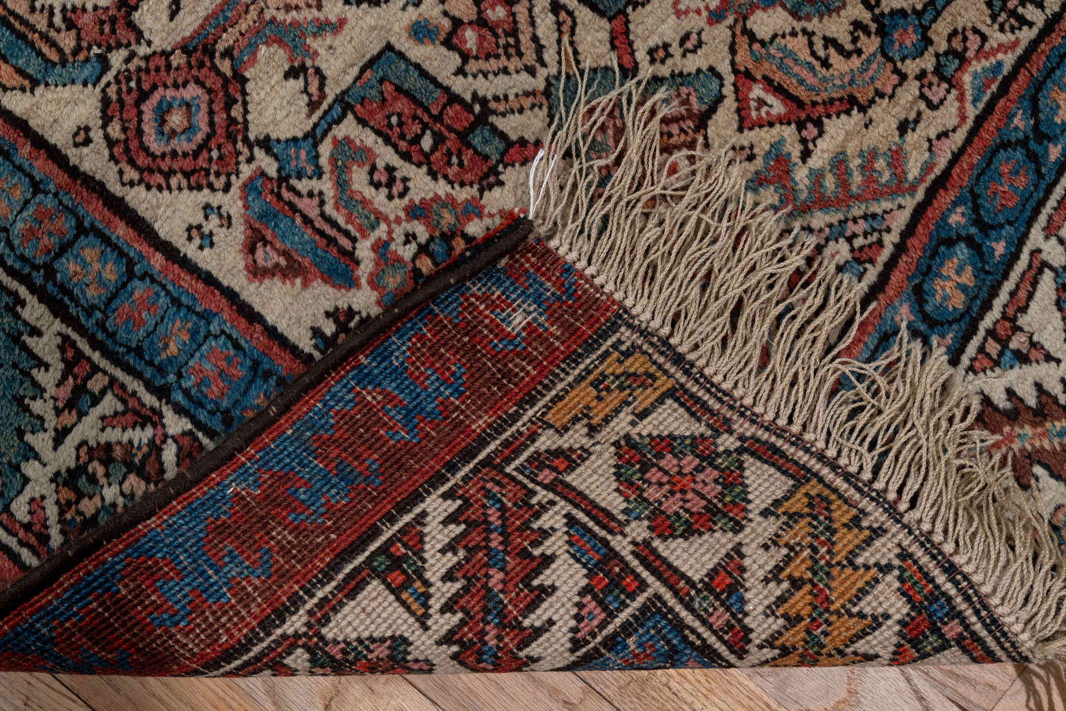 3' x 13' one-of-a-kind handmade antique Sarab runner rug. Color palette: ivory, rust, indigo, burgundy, camel, slate