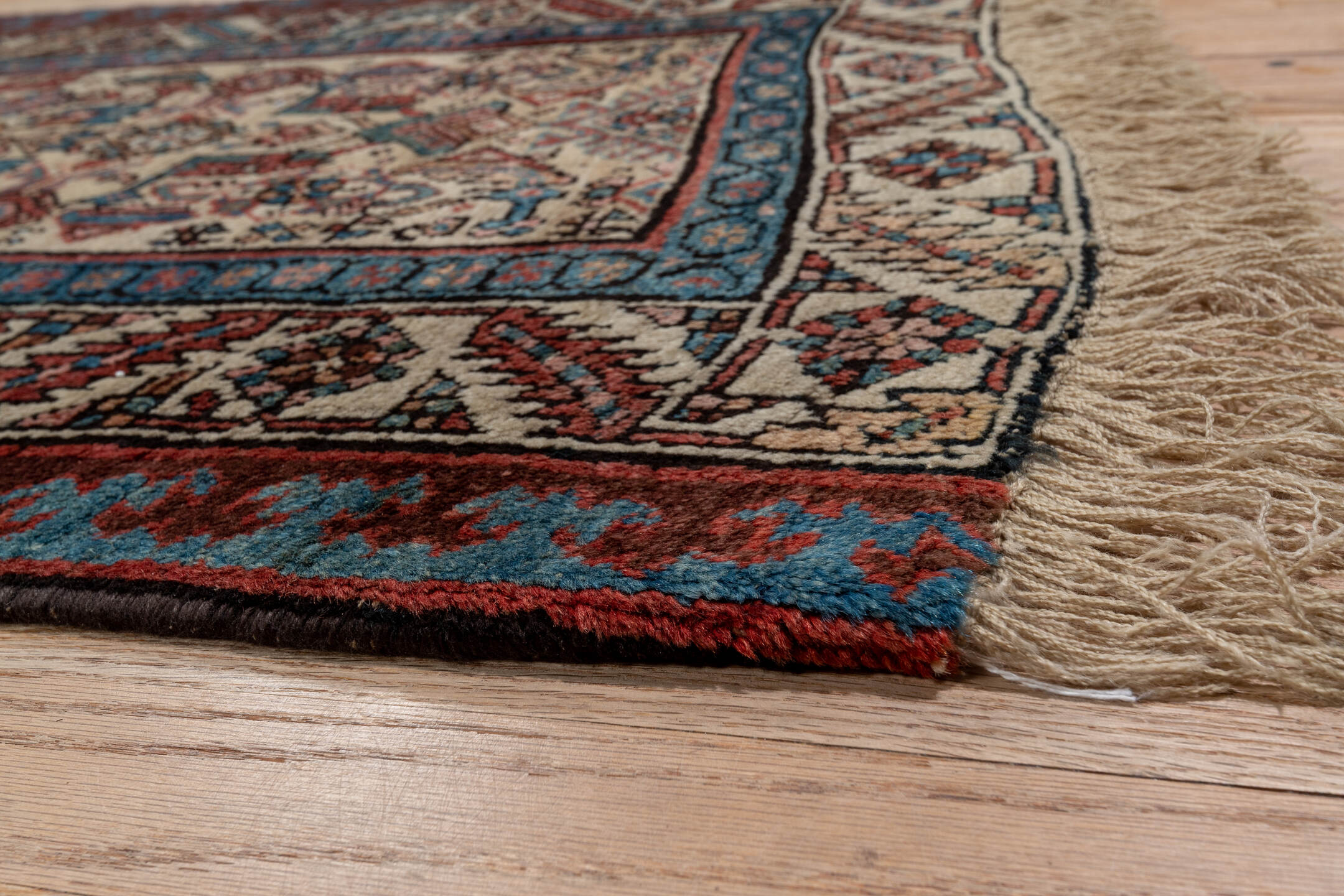 3' x 13' one-of-a-kind handmade antique Sarab runner rug. Color palette: ivory, rust, indigo, burgundy, camel, slate