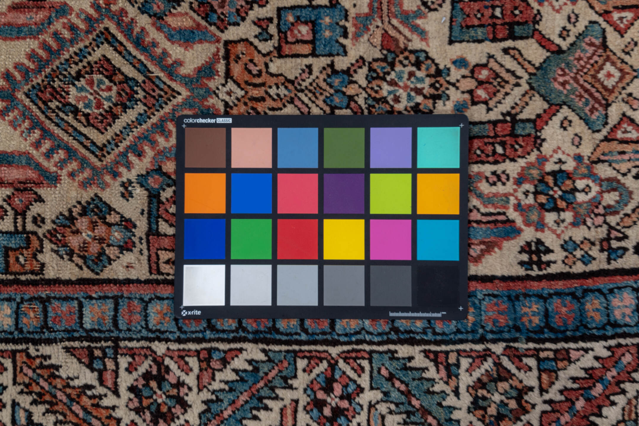 3' x 13' one-of-a-kind handmade antique Sarab runner rug. Color palette: ivory, rust, indigo, burgundy, camel, slate