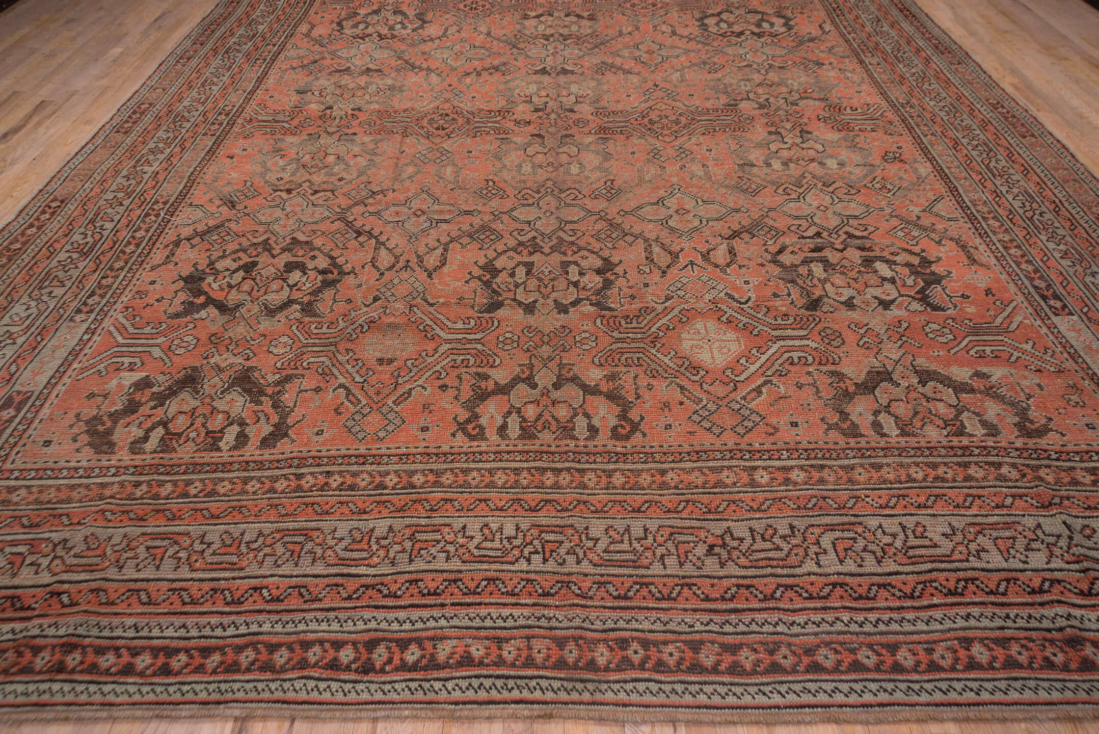 13' x 16' one-of-a-kind handmade antique Oushak oversize rug. Color palette: coral, taupe, charcoal, rose, ivory, brown