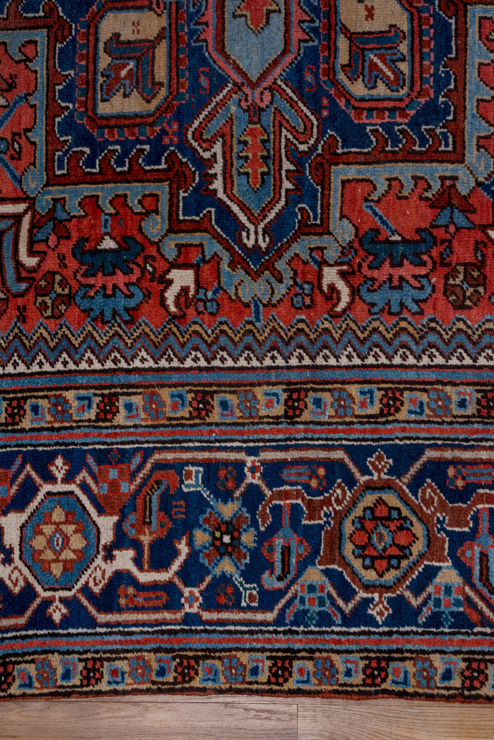 8' x 11' one-of-a-kind handmade antique Heriz large size rug. Color palette: rust, navy, ivory, sky blue, slate, camel