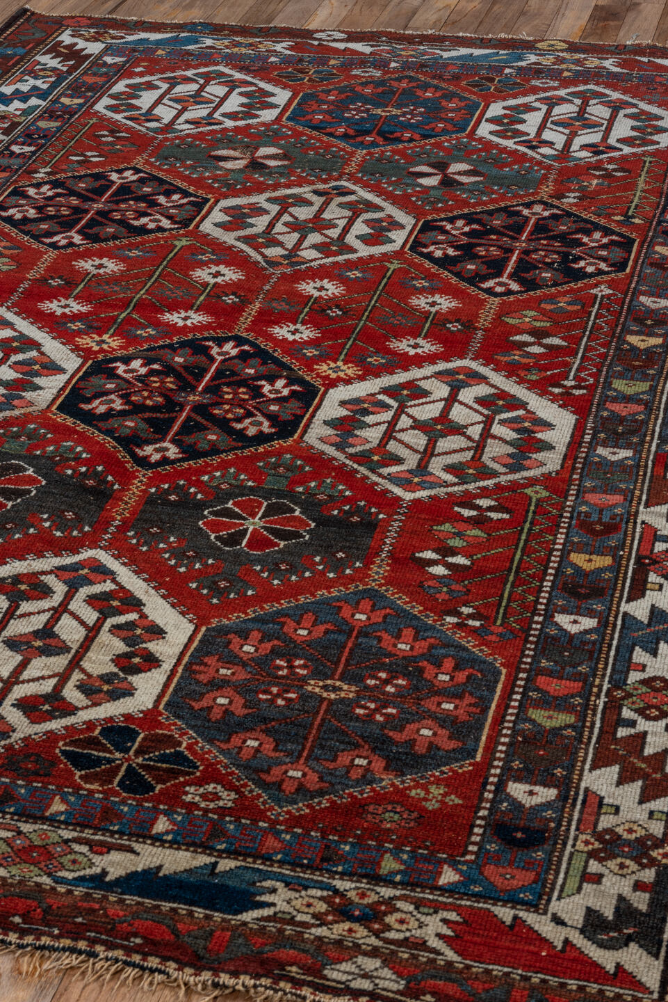 4' x 6' one-of-a-kind handmade antique Baktiary small size rug. Color palette: rust, ivory, navy, slate, burgundy, camel
