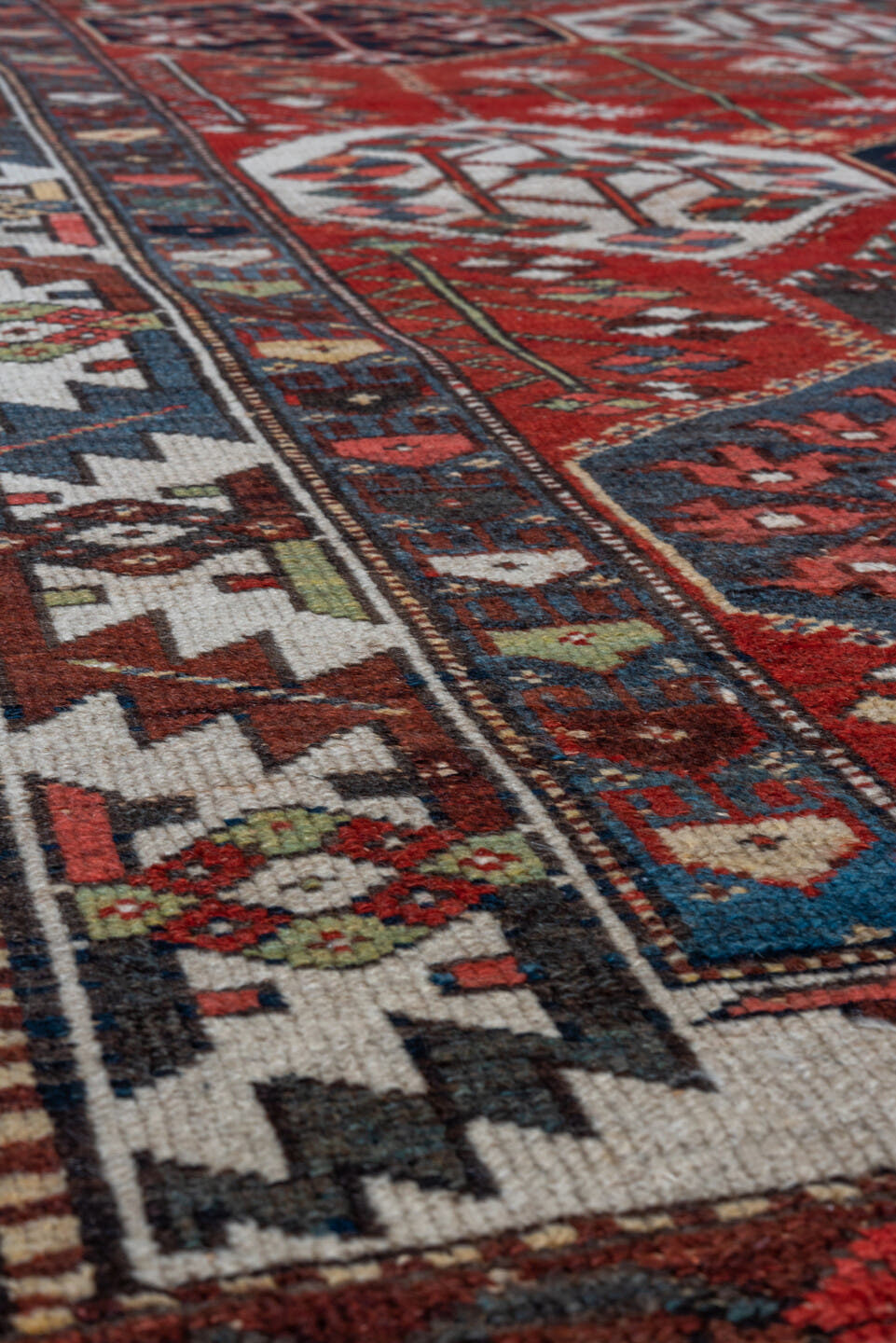4' x 6' one-of-a-kind handmade antique Baktiary small size rug. Color palette: rust, ivory, navy, slate, burgundy, camel