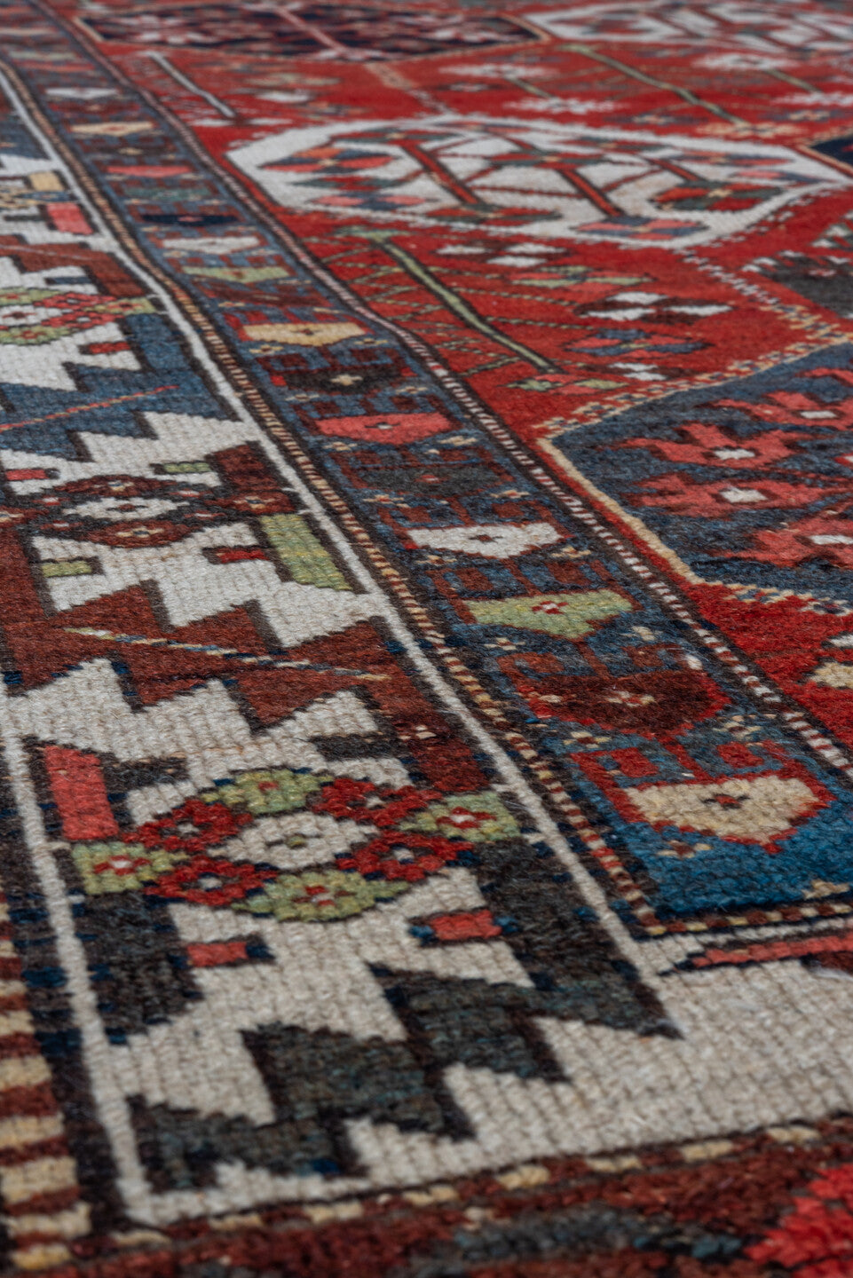 4' x 6' one-of-a-kind handmade antique Baktiary small size rug. Color palette: rust, ivory, navy, slate, burgundy, camel