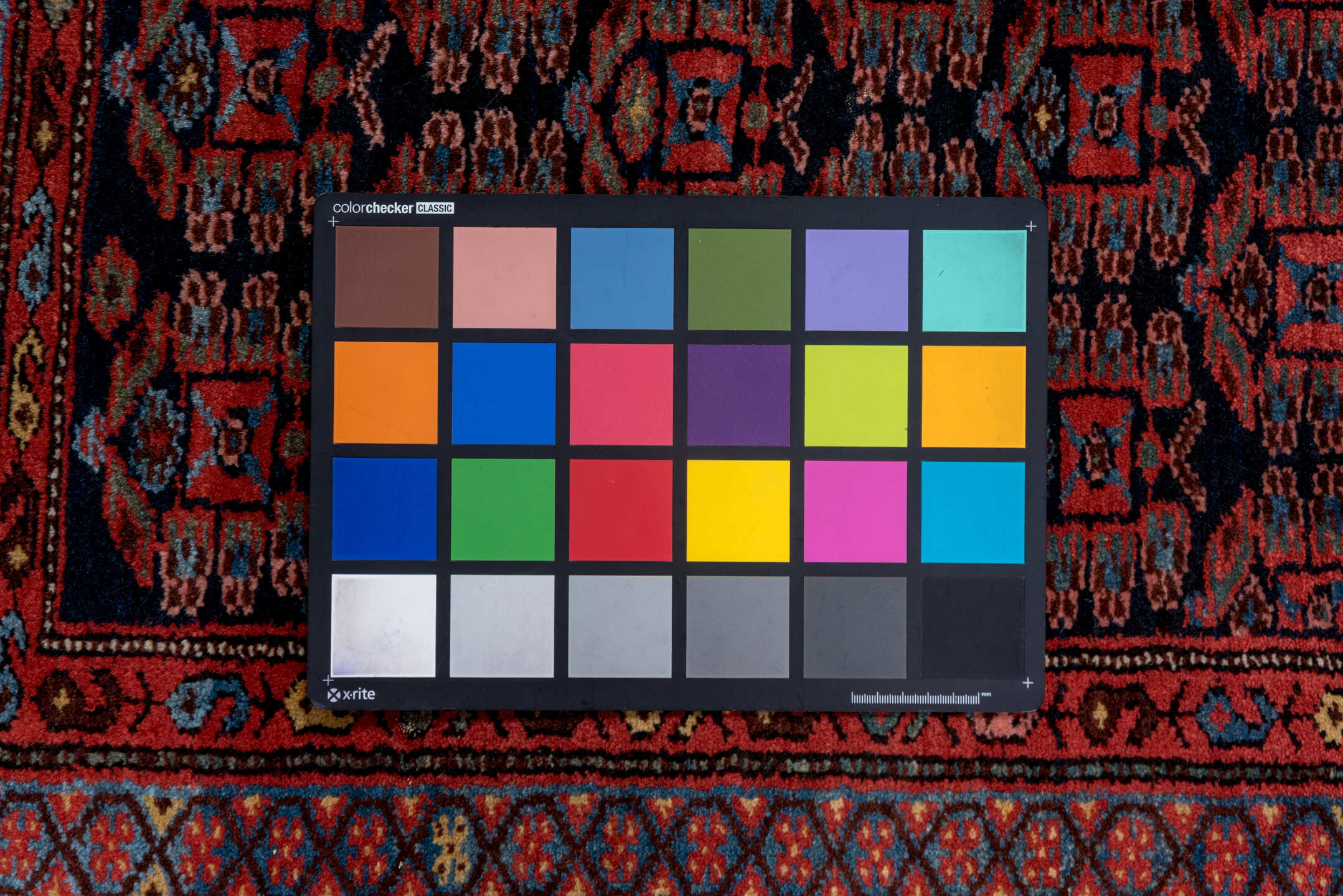 3' x 6' one-of-a-kind handmade vintage Kurd small size rug. Color palette: blue, brown, gray, off-white, pink, red, snow