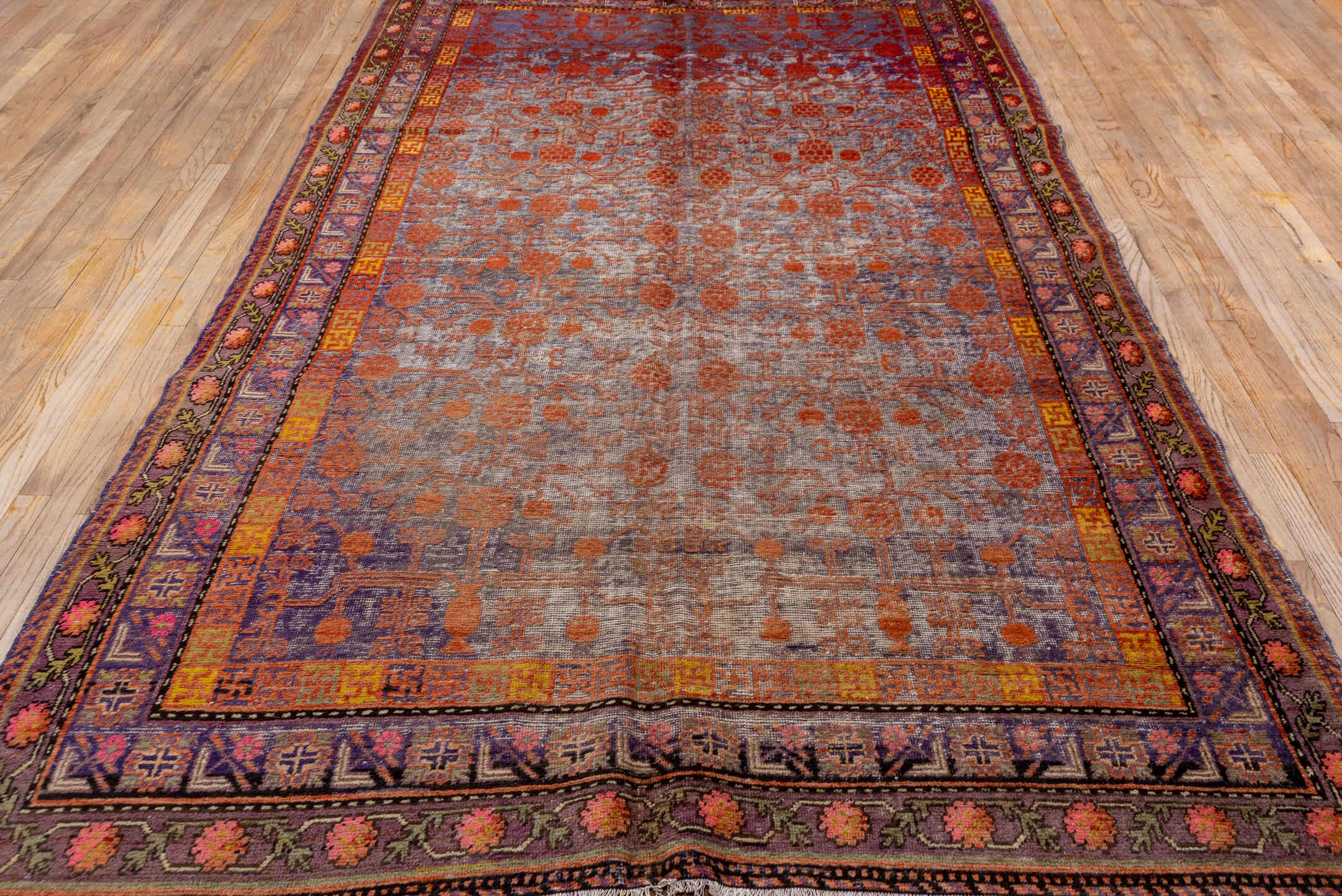 6' x 11' one-of-a-kind handmade vintage Khotan large size rug. Color palette: brown, gray, pink, red, yellow