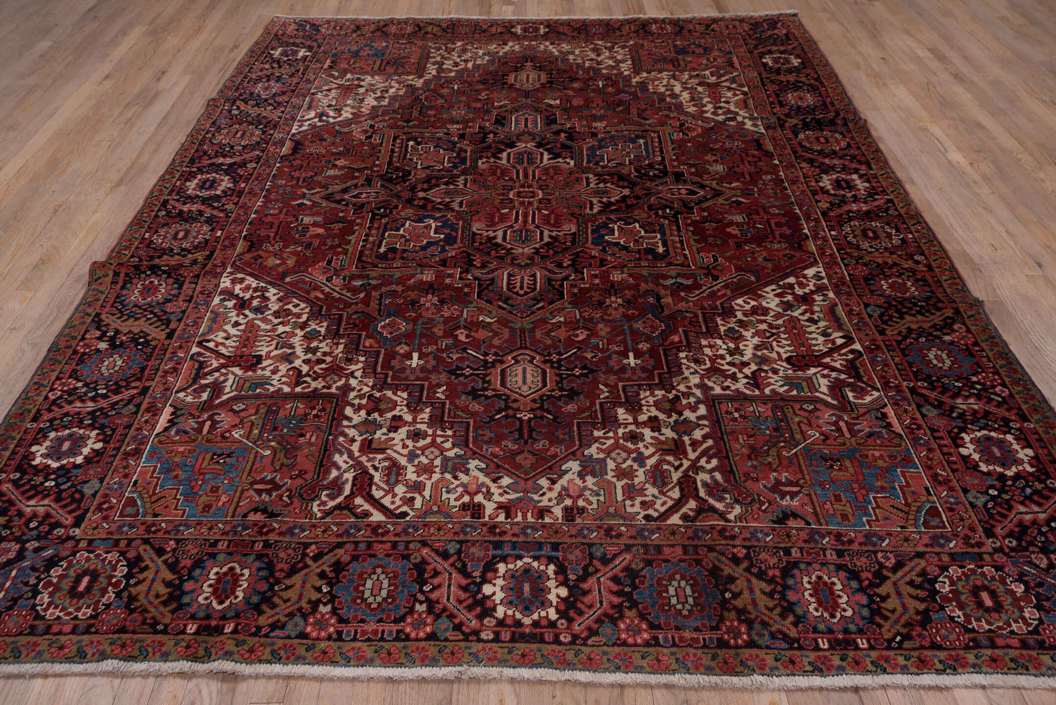 8' x 10' one-of-a-kind handmade vintage Heriz large size rug. Color palette: black, blue, brown, fiord, gray, pink, red