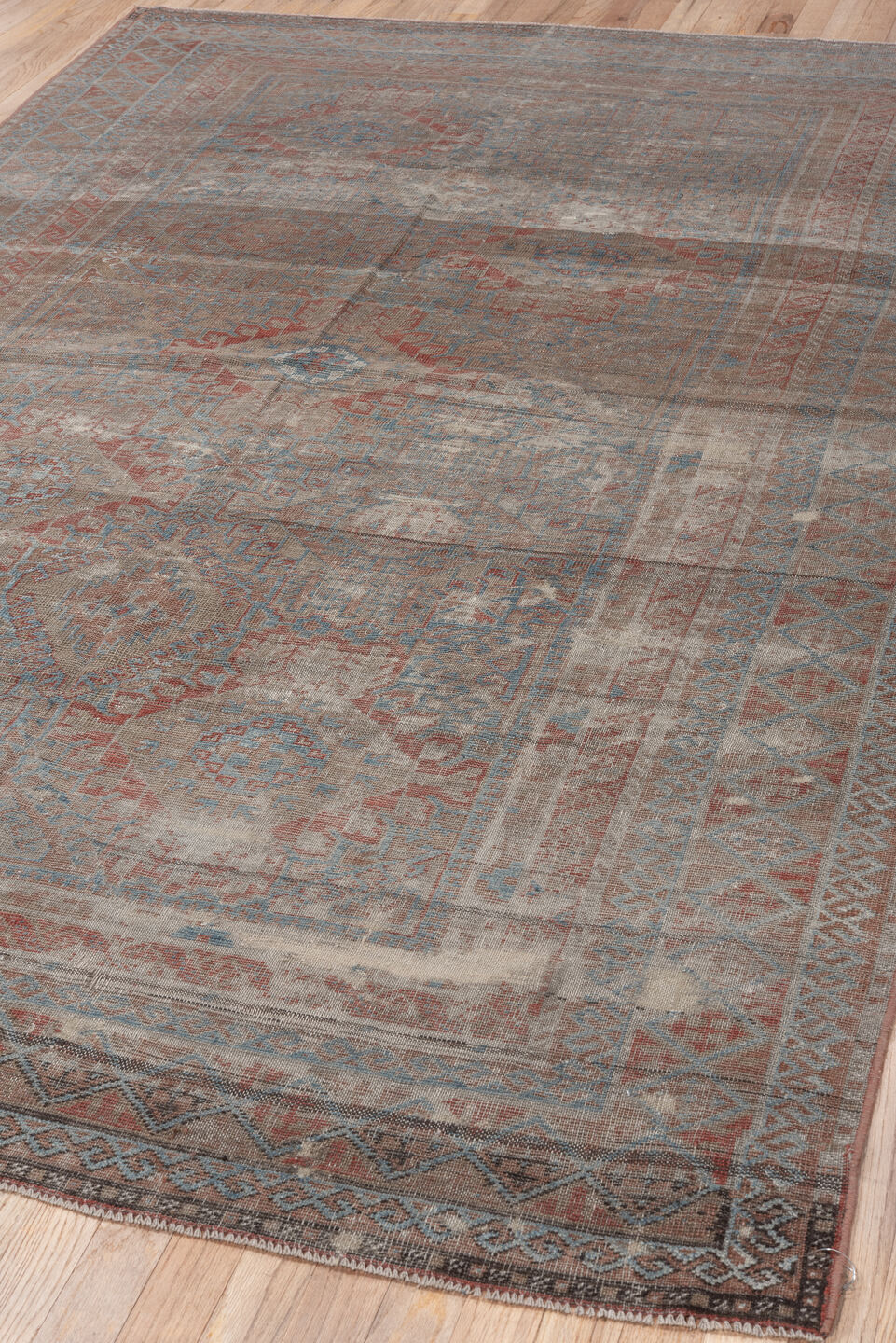 5' x 10' one-of-a-kind handmade vintage Belouch runner rug. Color palette: taupe, ivory, sky blue, rust, brown, camel