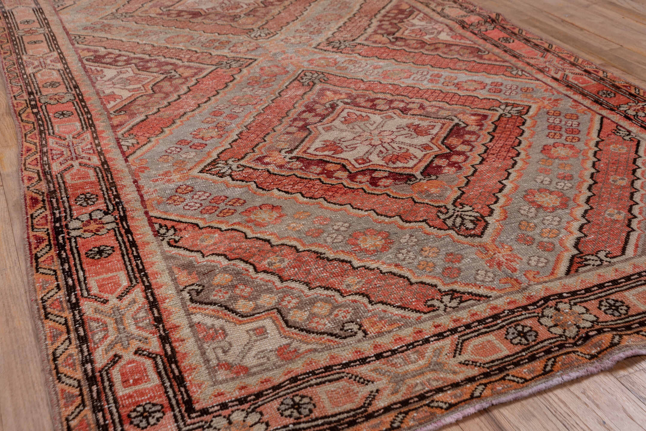 4' x 8' one-of-a-kind handmade vintage Khotan rug. Color palette: brown, gray, pink, red, redwood