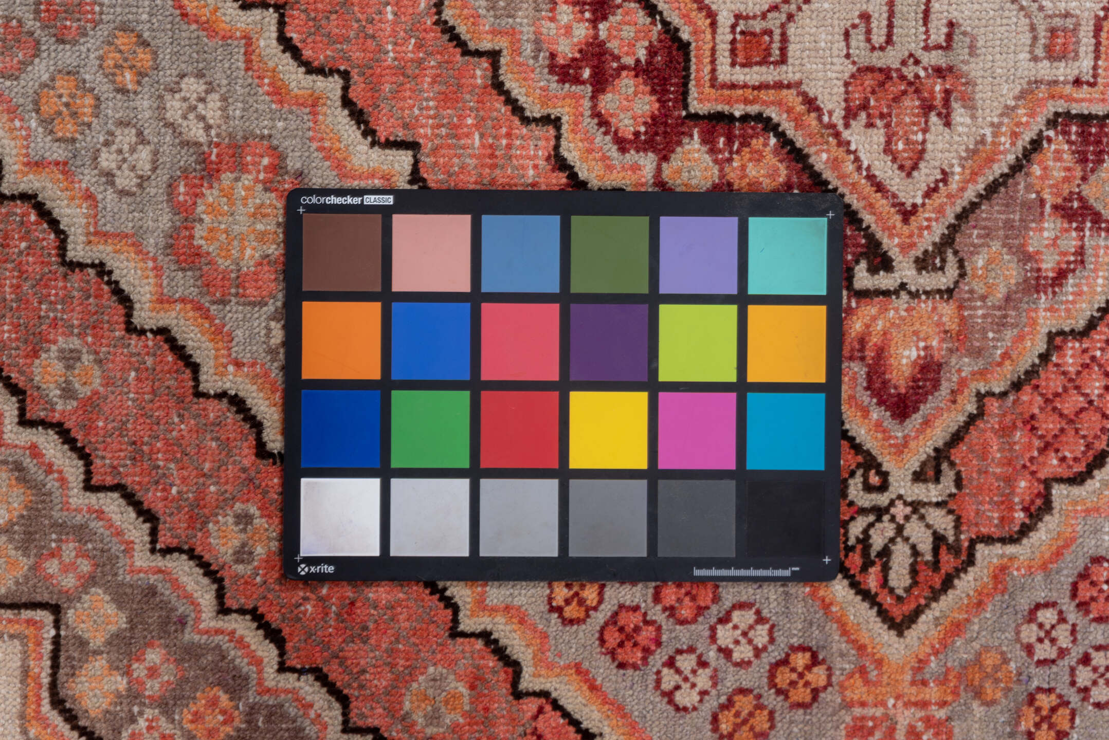 4' x 8' one-of-a-kind handmade vintage Khotan rug. Color palette: brown, gray, pink, red, redwood