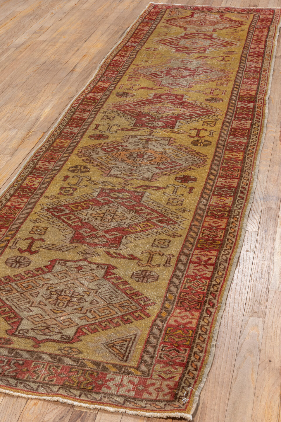 2' x 10' one-of-a-kind handmade vintage Oushak runner rug. Color palette: brown, off-white, pink, red, snow, white