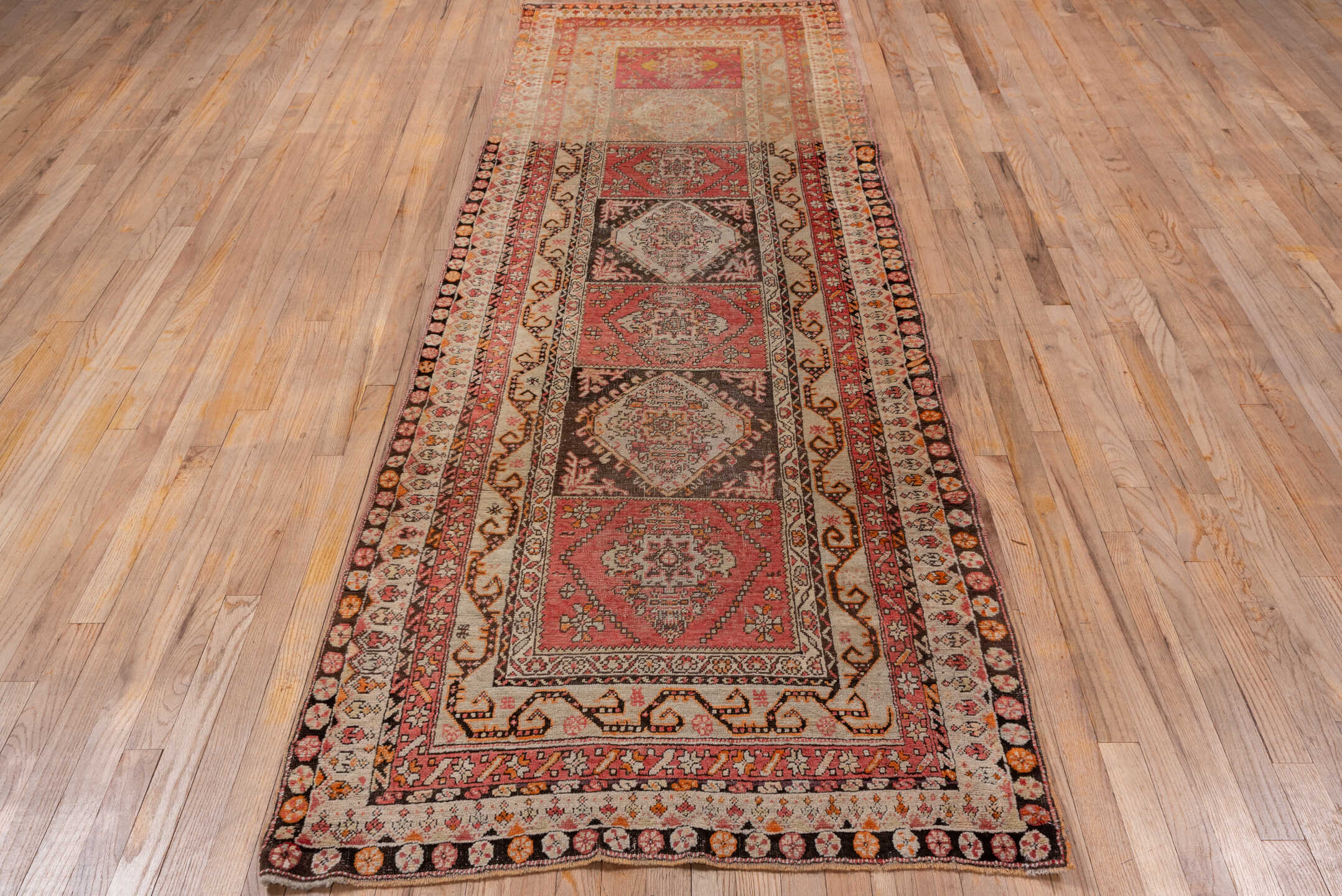 3' x 10' one-of-a-kind handmade antique Sivas runner rug. Color palette: rose, ivory, brown, rust, charcoal, taupe, coral