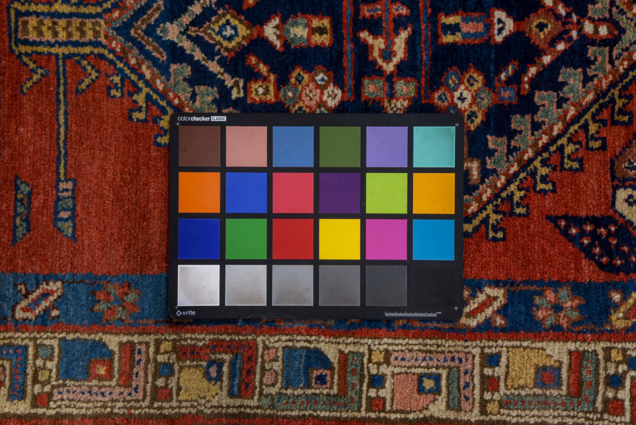 3' x 9' one-of-a-kind handmade vintage Heriz runner rug. Color palette: blue, brown, gray, maroon, pink, red, redwood