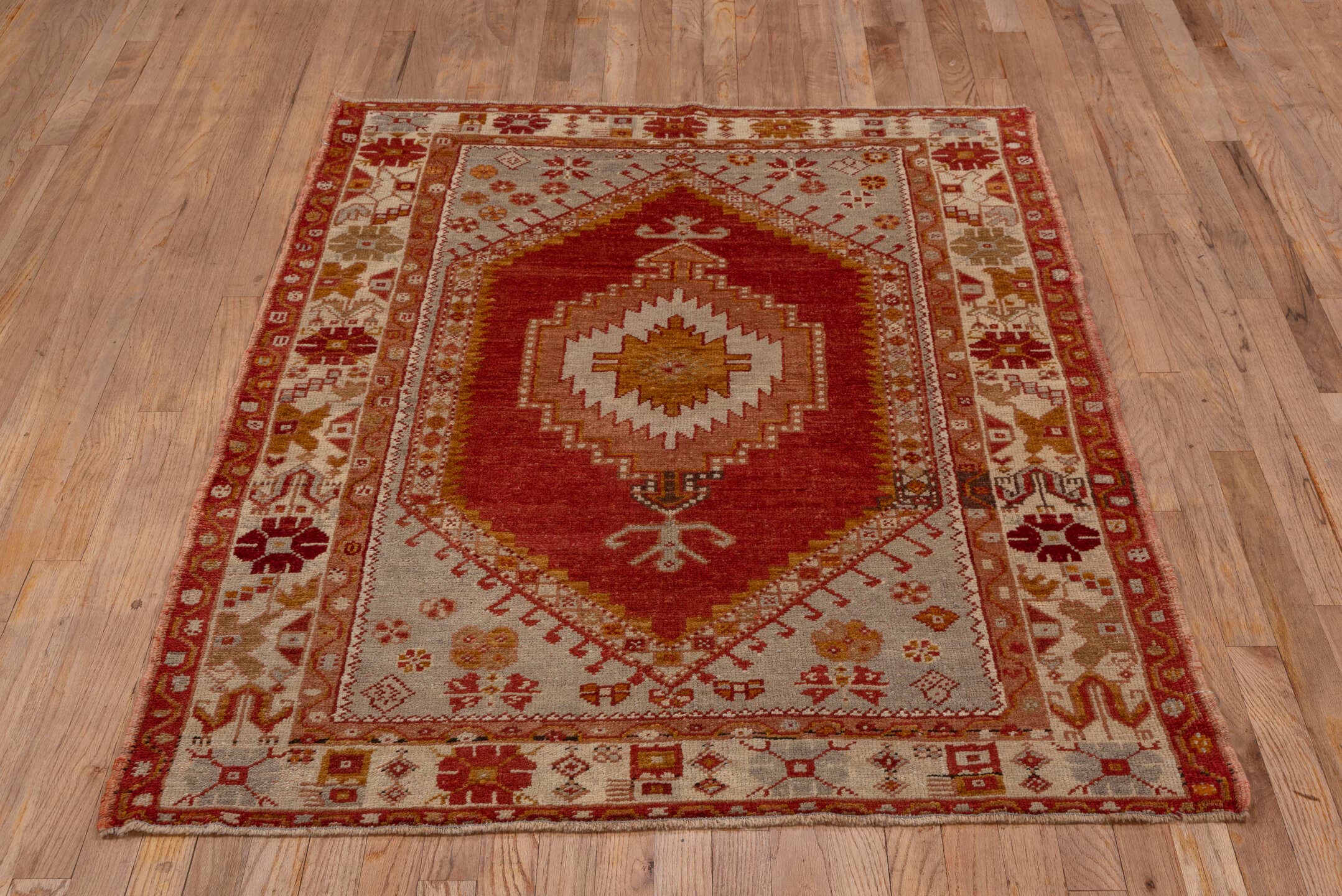 3' x 5' one-of-a-kind handmade vintage Oushak small size rug. Color palette: rust, ivory, terra cotta, gold, camel, rose