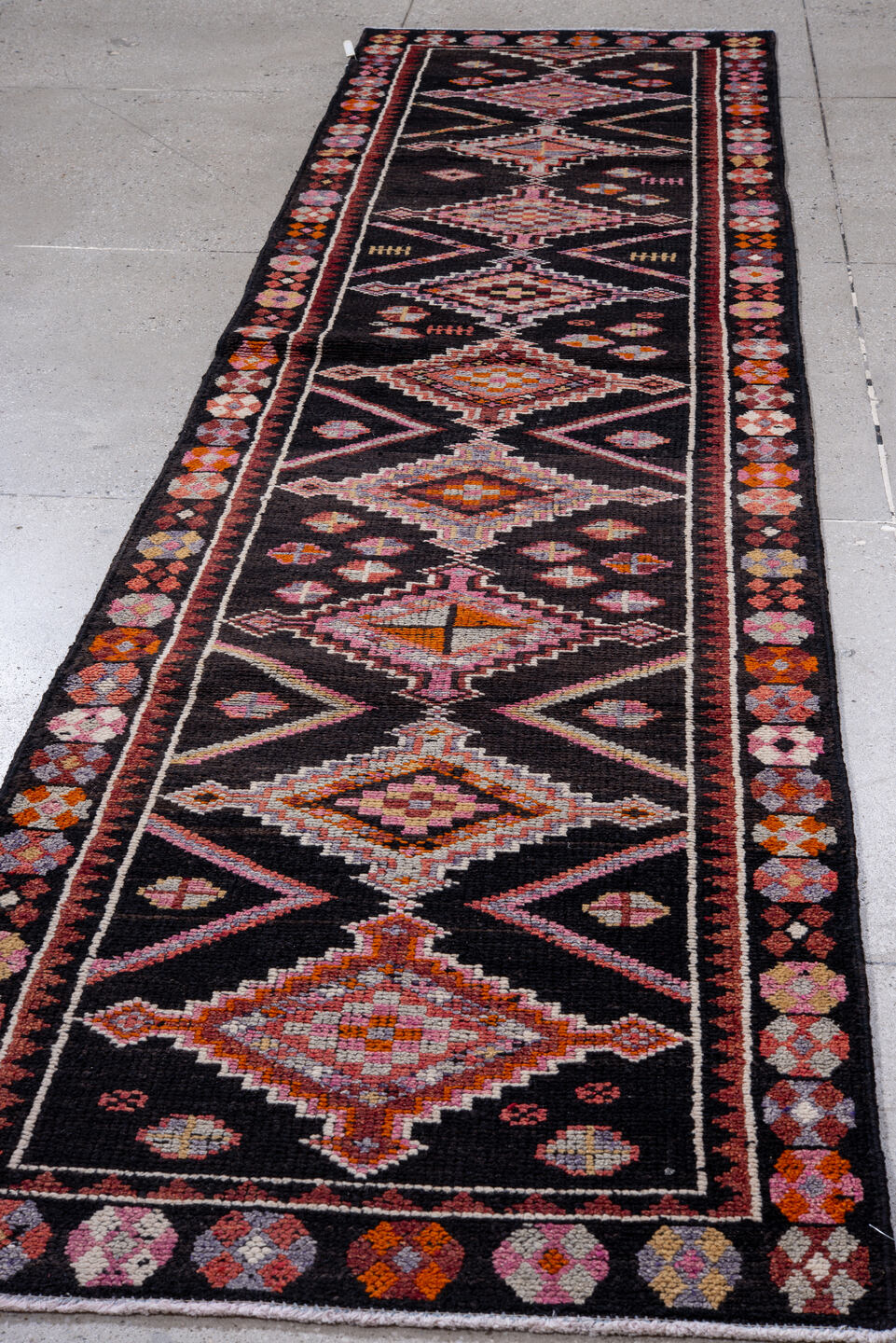 3' x 12' one-of-a-kind handmade vintage Oushak runner rug. Color palette: black, brown, gray, indian red, light gray