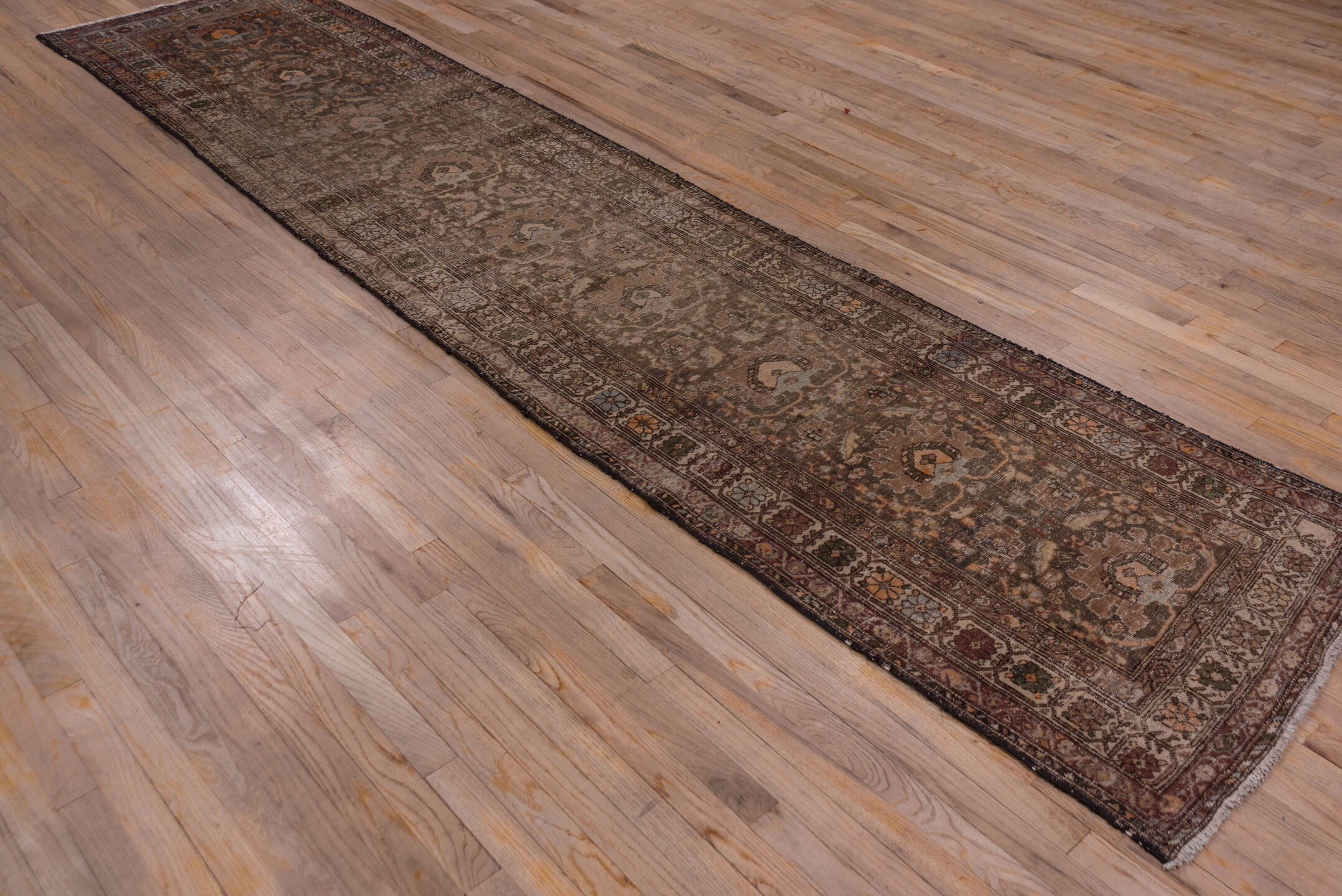 2' x 13' one-of-a-kind handmade vintage Sarab runner rug. Color palette: brown, dark gray, gray, pink, saddle brown