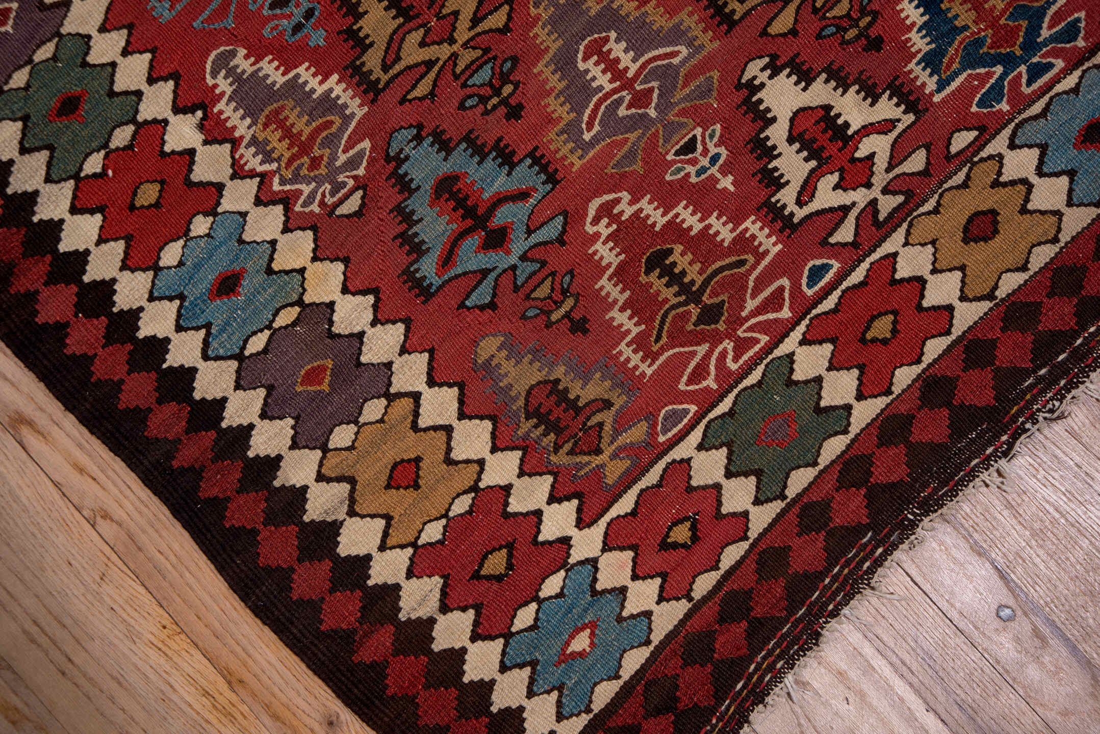 5' x 13' one-of-a-kind handmade antique Kilim rug. Color palette: rust, ivory, indigo, camel, charcoal, sky blue, burgundy