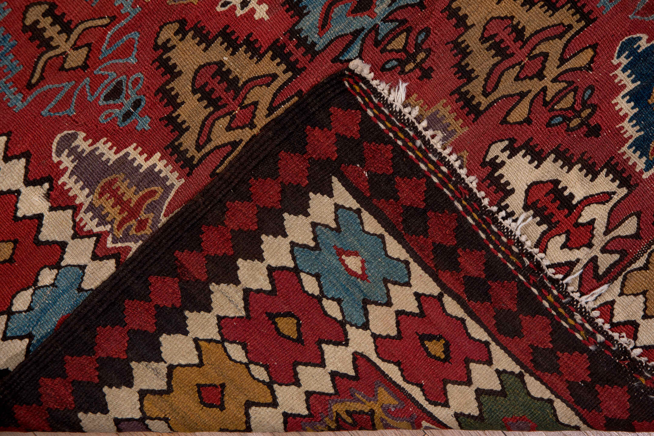 5' x 13' one-of-a-kind handmade antique Kilim rug. Color palette: rust, ivory, indigo, camel, charcoal, sky blue, burgundy