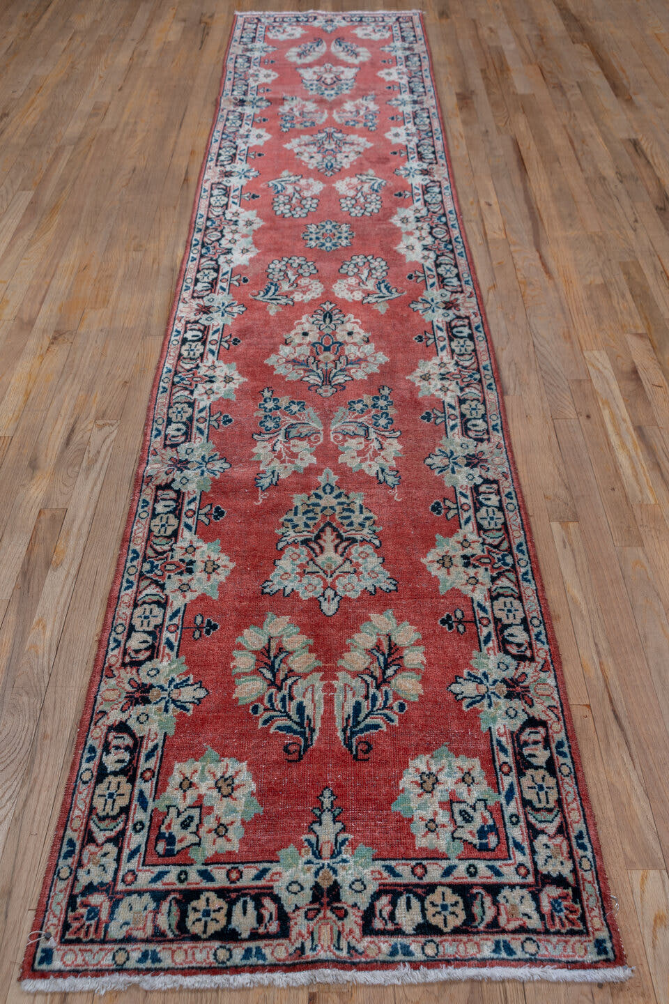 2' x 13' one-of-a-kind handmade vintage Mahal runner rug. Color palette: coral, ivory, navy, slate, rose, charcoal