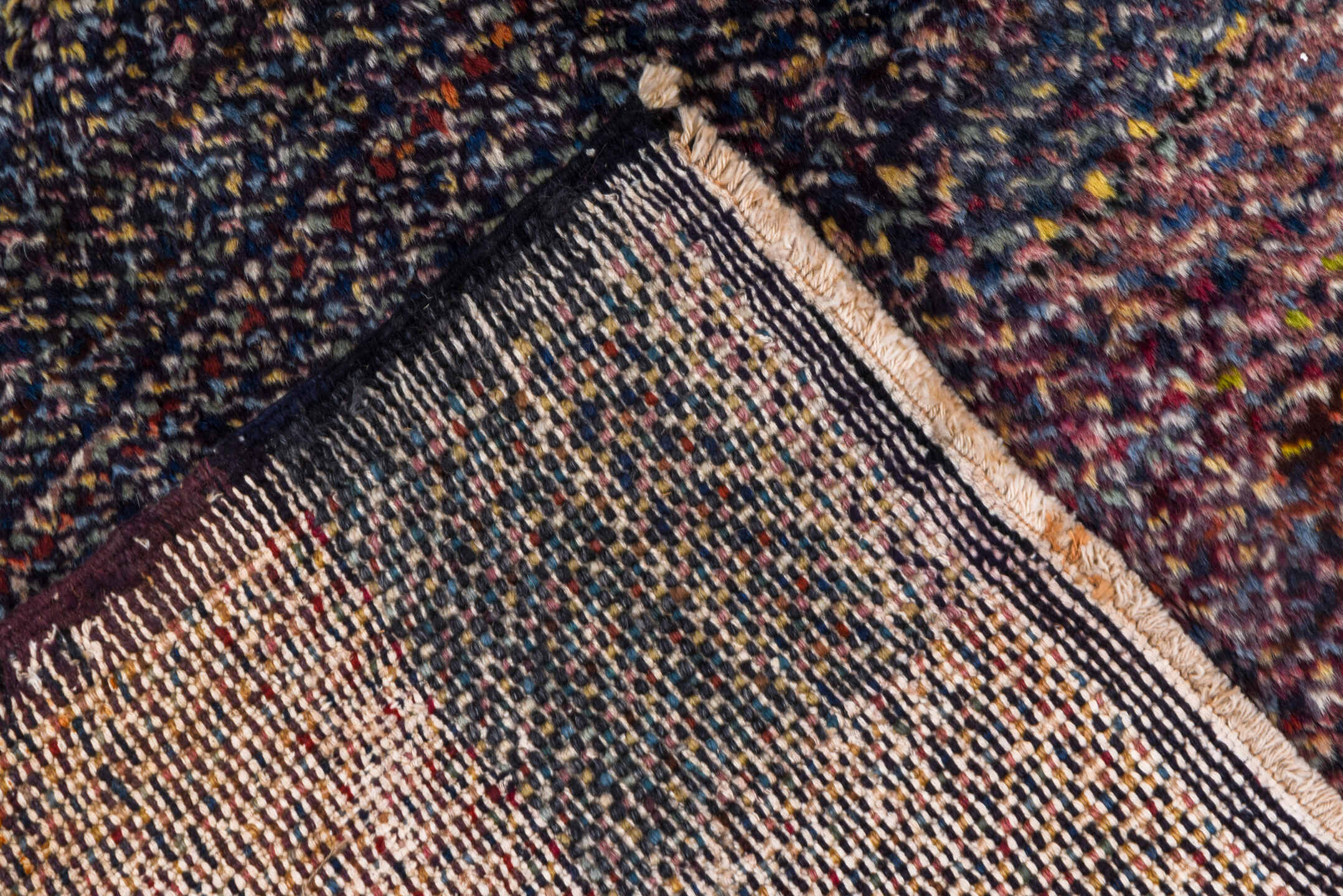 5' x 9' one-of-a-kind handmade vintage Sparta medium size rug. Color palette: indigo, plum, charcoal, rose, lavender, taupe