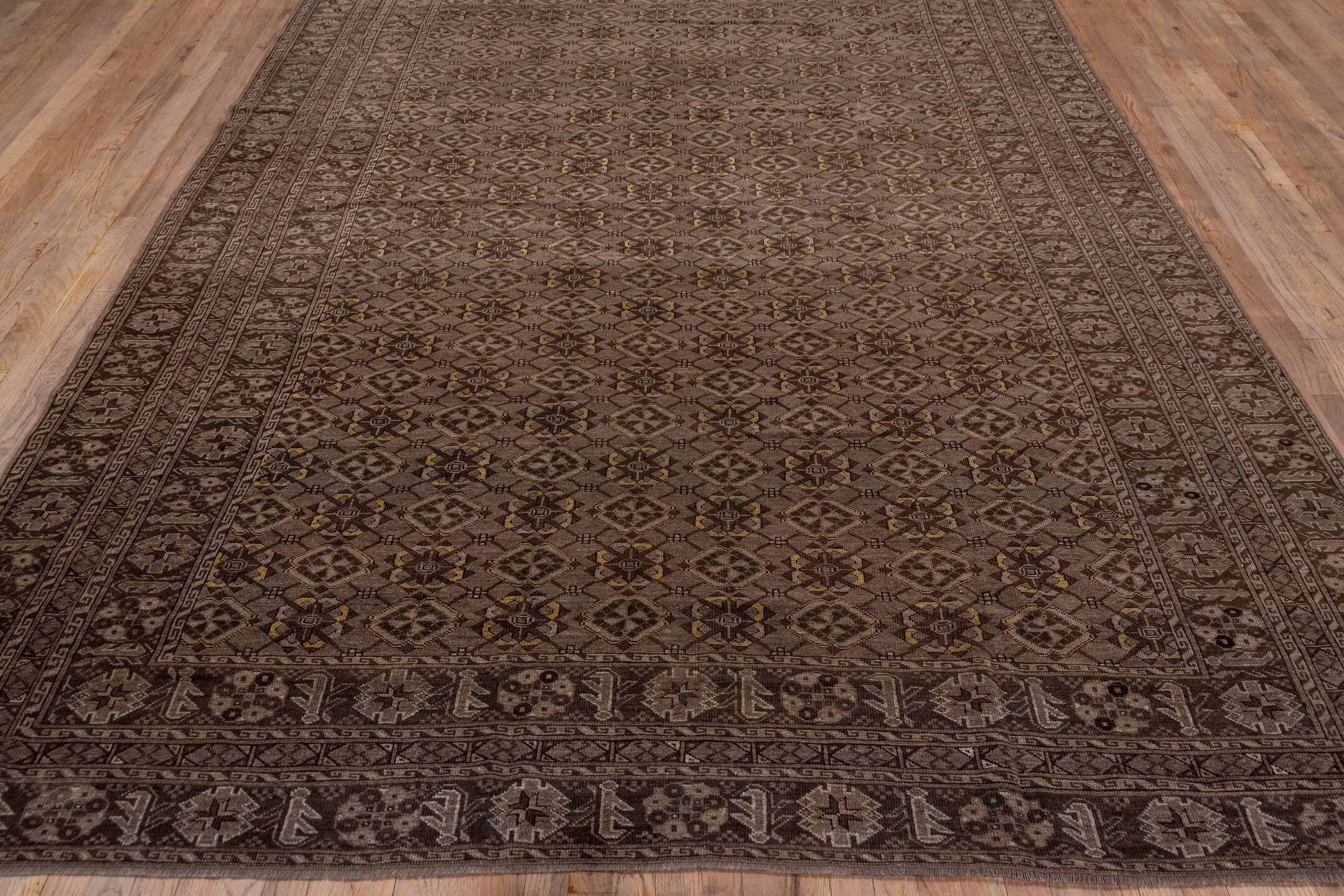 8' x 11' one-of-a-kind handmade vintage Afghan large size rug. Color palette: brown, gray, light gray, off-white, pink, snow