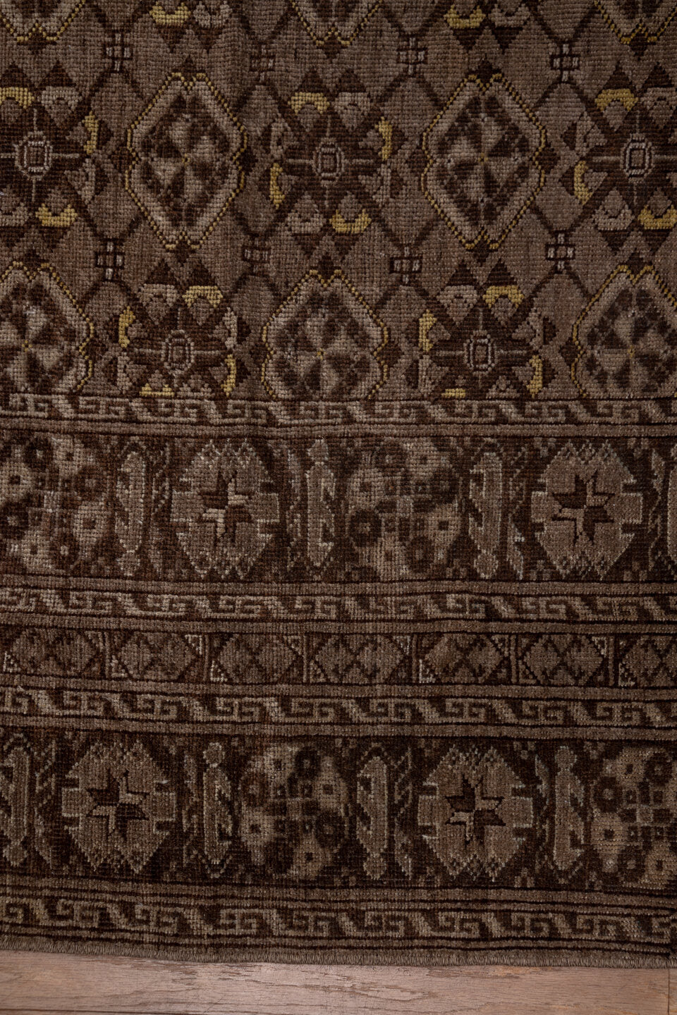 8' x 11' one-of-a-kind handmade vintage Afghan large size rug. Color palette: brown, gray, light gray, off-white, pink, snow