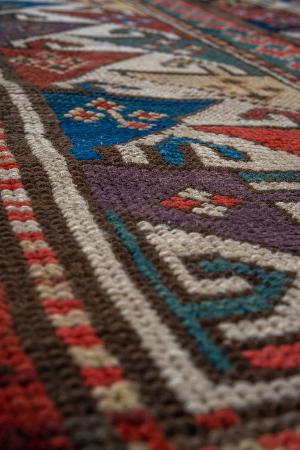 3' x 6' one-of-a-kind handmade antique Kazak small size rug. Color palette: ivory, navy, turquoise, rust, camel, terracotta