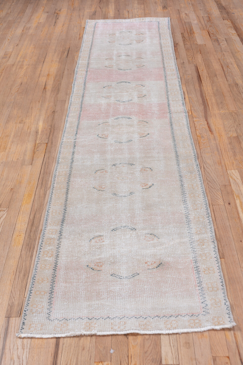 2' x 11' one-of-a-kind handmade antique Oushak runner rug. Color palette: blush, ivory, pale peach, taupe, slate, pink