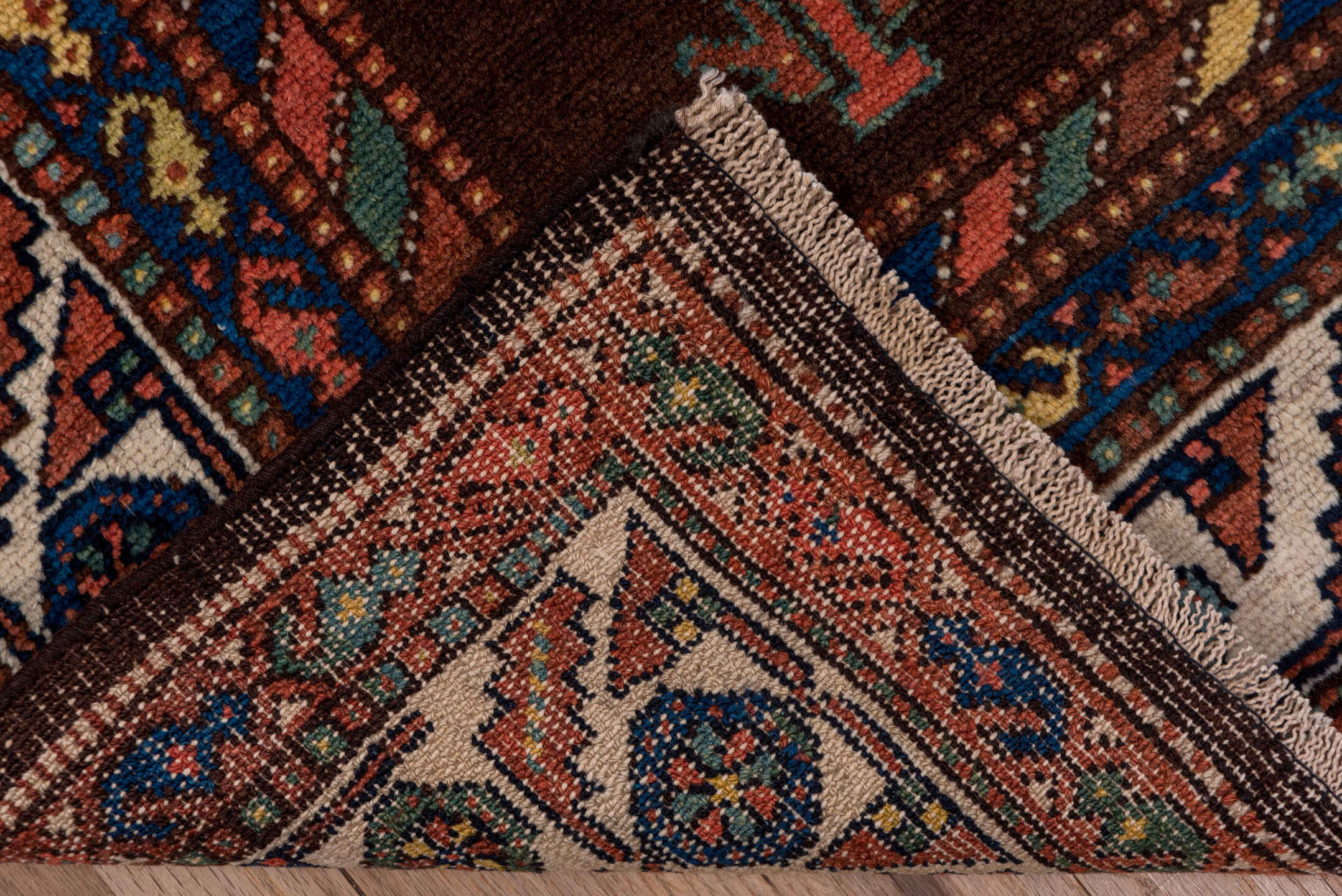 4' x 11' one-of-a-kind handmade antique Malayer runner rug. Color palette: brown, rust, ivory, navy, terra cotta, indigo