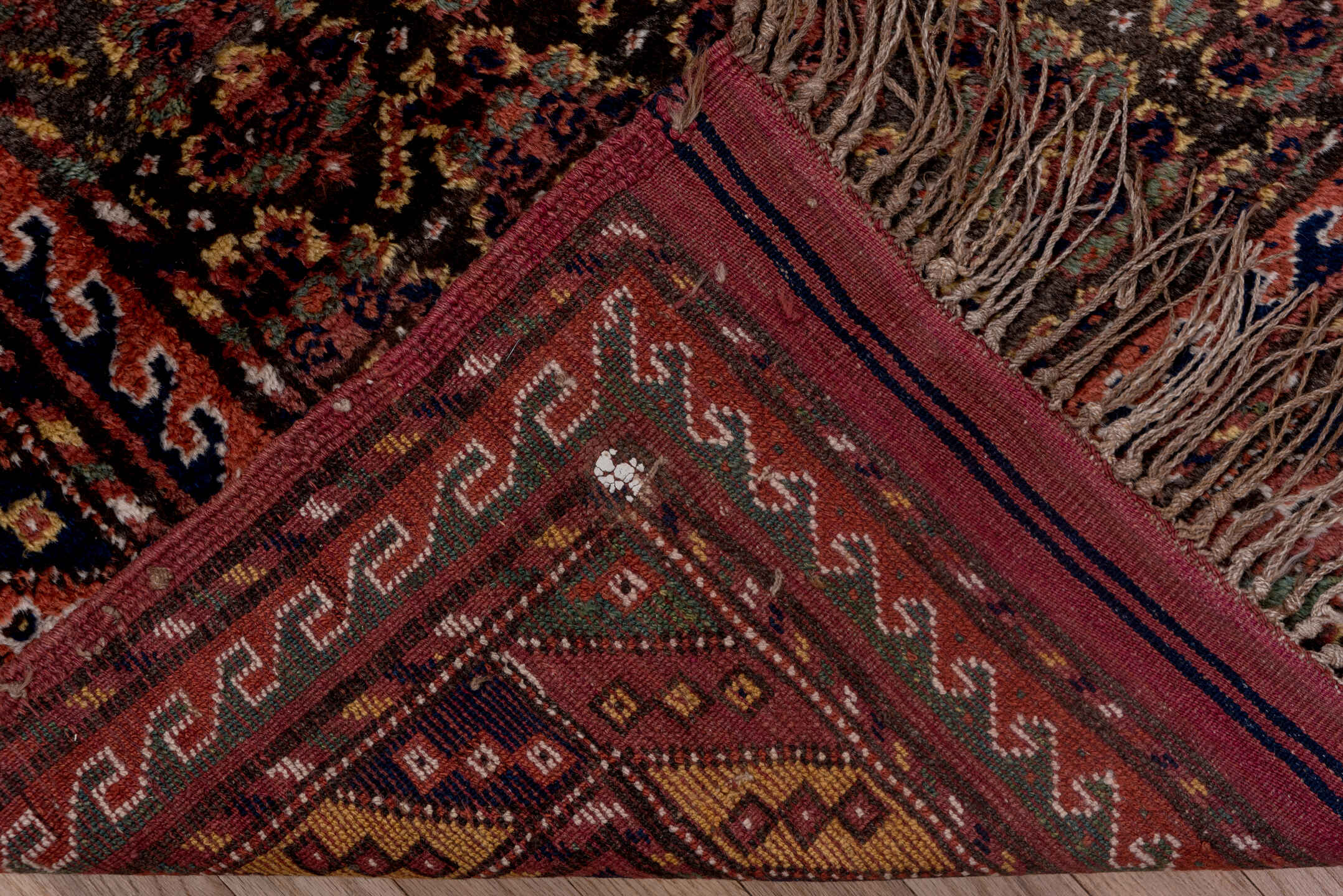 4' x 9' one-of-a-kind handmade antique Kurd rug. Color palette: rust, navy, brown, rose, ivory, gold, sage, terracotta, blue