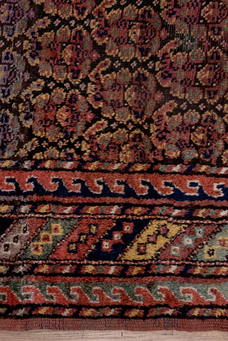 4' x 9' one-of-a-kind handmade antique Kurd rug. Color palette: rust, navy, brown, rose, ivory, gold, sage, terracotta, blue