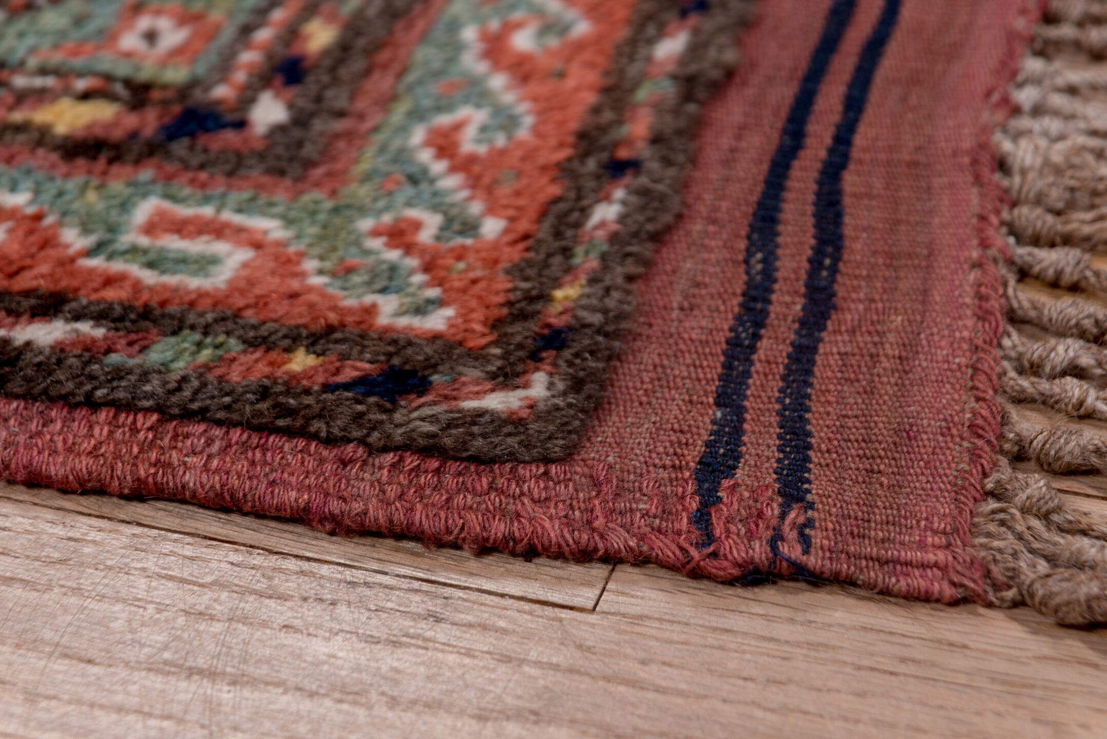 4' x 9' one-of-a-kind handmade antique Kurd rug. Color palette: rust, navy, brown, rose, ivory, gold, sage, terracotta, blue