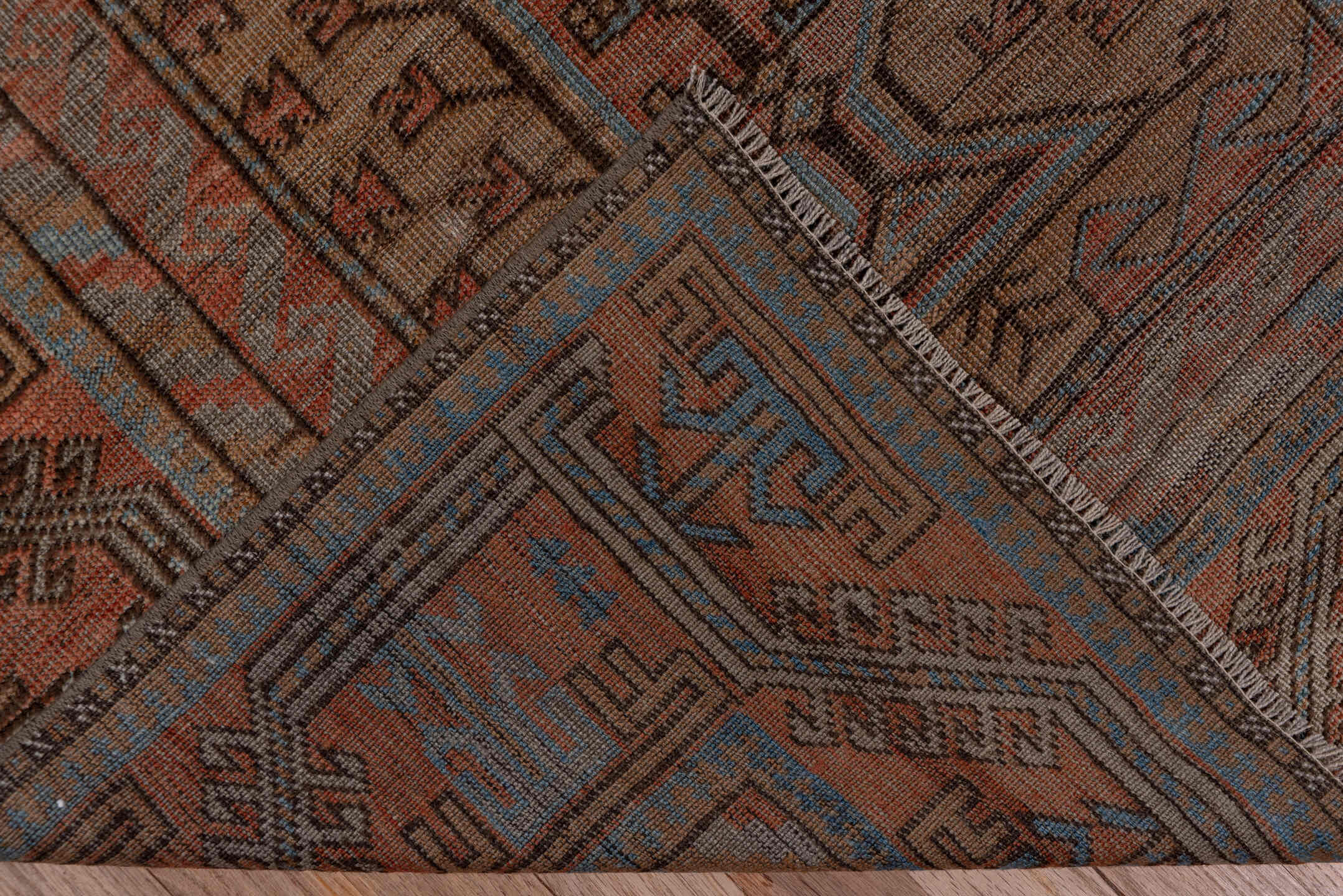 5' x 9' one-of-a-kind handmade antique Belouch large size rug. Color palette: rust, brown, slate, taupe, charcoal
