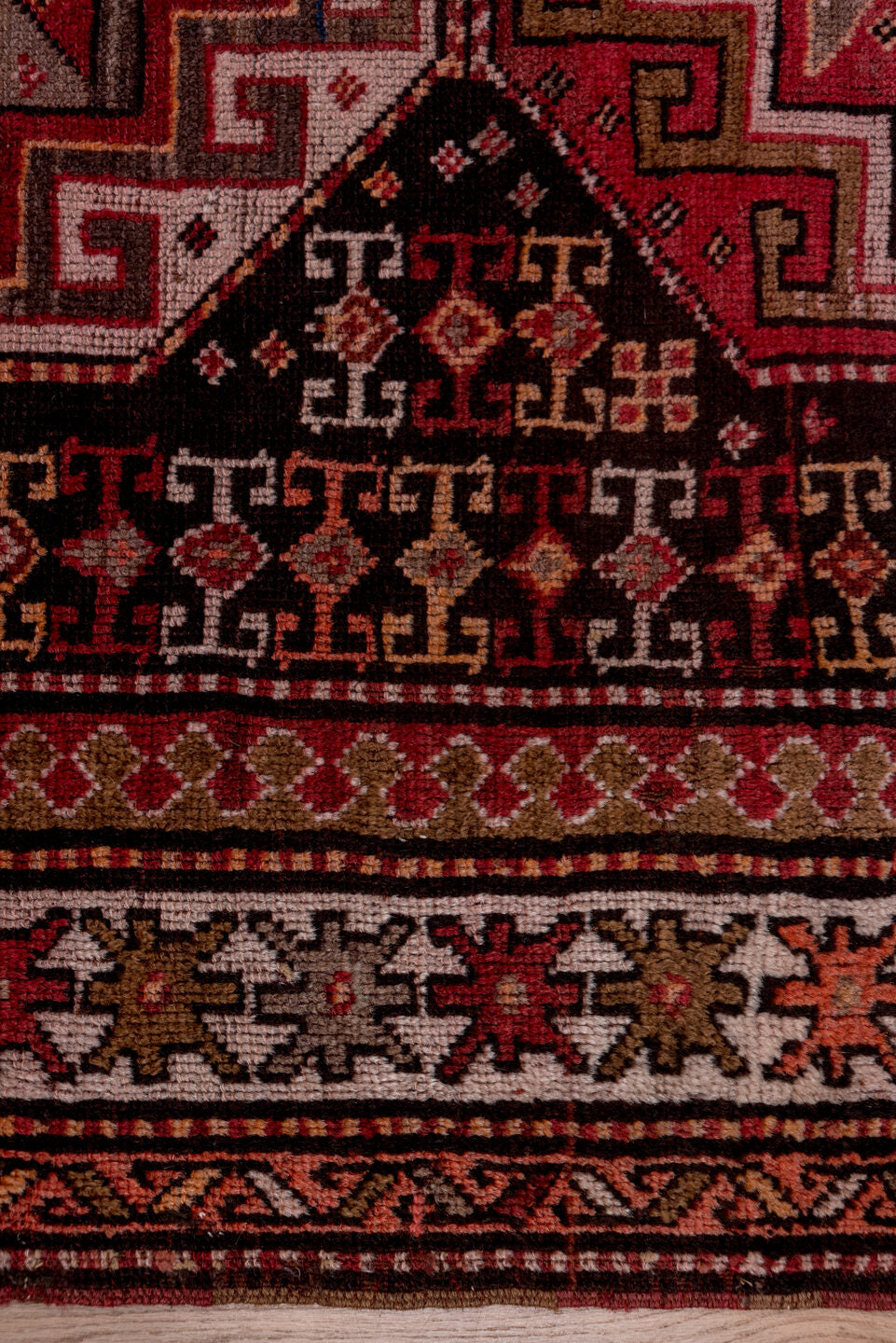 4' x 9' one-of-a-kind handmade vintage Kazak runner rug. Color palette: brown, gray, pink, red, rosy brown