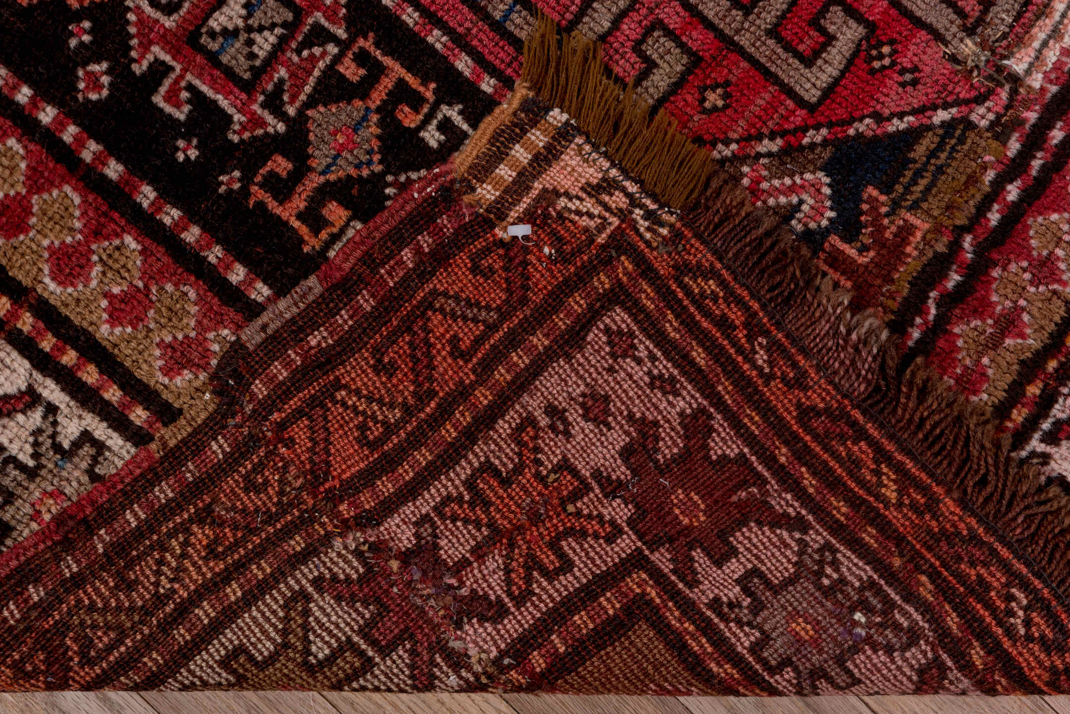 4' x 9' one-of-a-kind handmade antique Kazak runner rug. Color palette: rust, ivory, burgundy, charcoal, rose, taupe