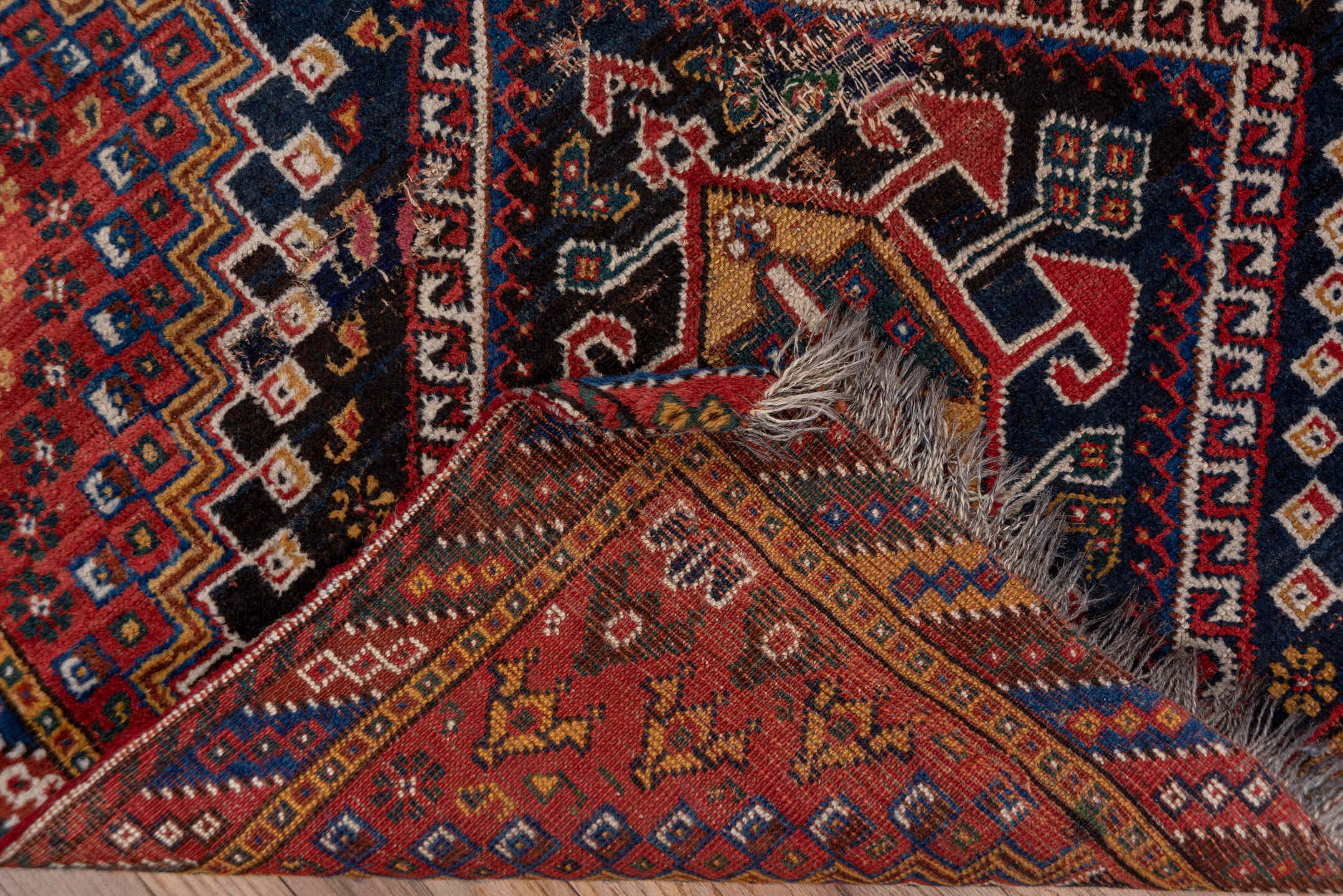 3' x 9' one-of-a-kind handmade vintage Shiraz runner rug. Color palette: black, blue, brown, fiord, gray, pink, red