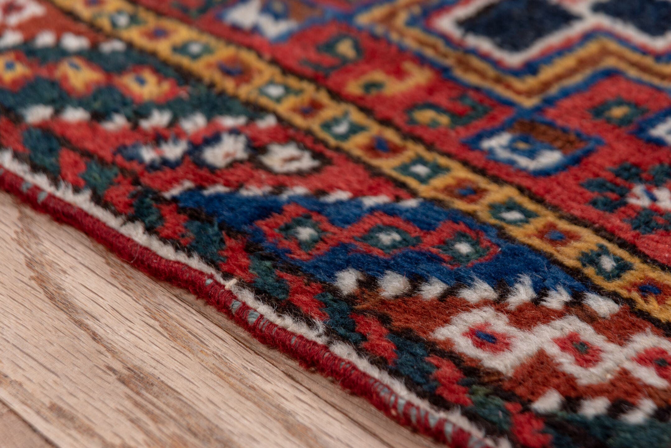 3' x 9' one-of-a-kind handmade antique Shiraz runner rug. Color palette: rust, navy, ivory, indigo, camel, gold, crimson