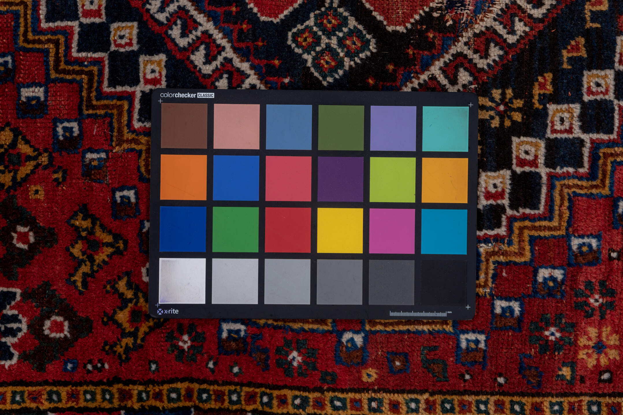 3' x 9' one-of-a-kind handmade vintage Shiraz runner rug. Color palette: black, blue, brown, fiord, gray, pink, red