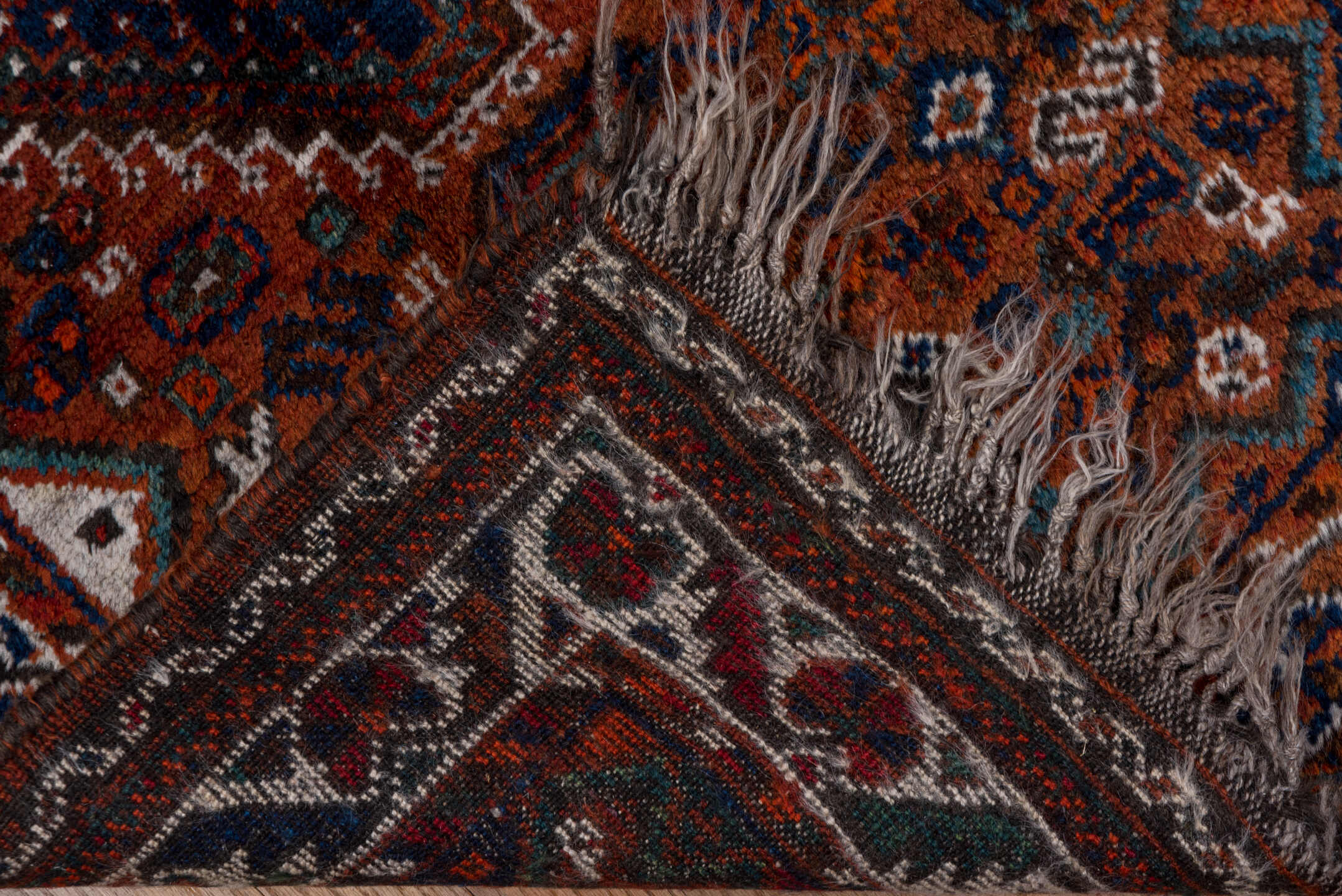 2' x 4' one-of-a-kind handmade antique Shiraz small size rug. Color palette: rust, indigo, ivory, terra cotta, teal
